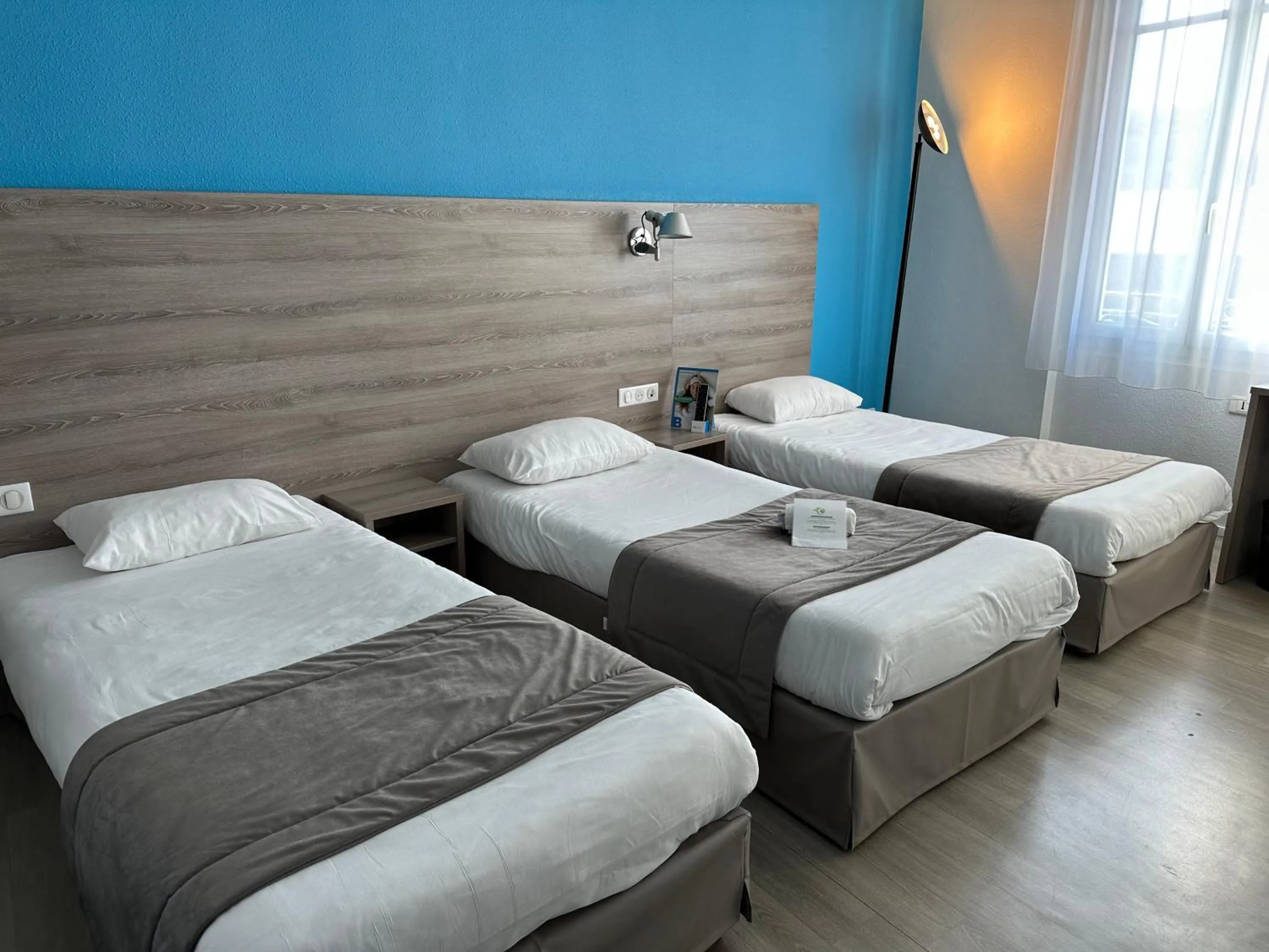 Photo of the whole room, Bed in BRIT HOTEL CONFORT NEVERS Centre Gare