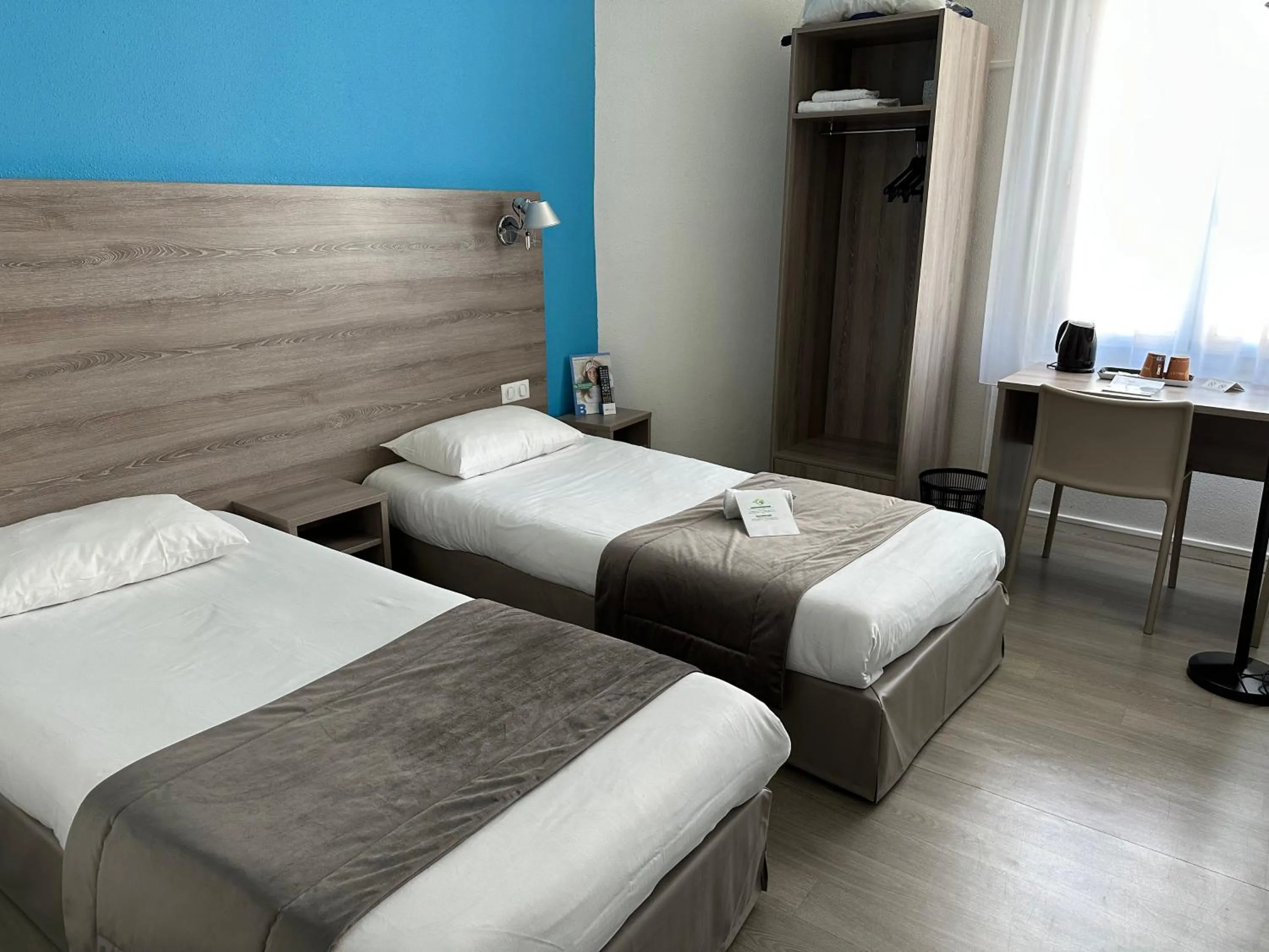 Photo of the whole room, Bed in BRIT HOTEL CONFORT NEVERS Centre Gare