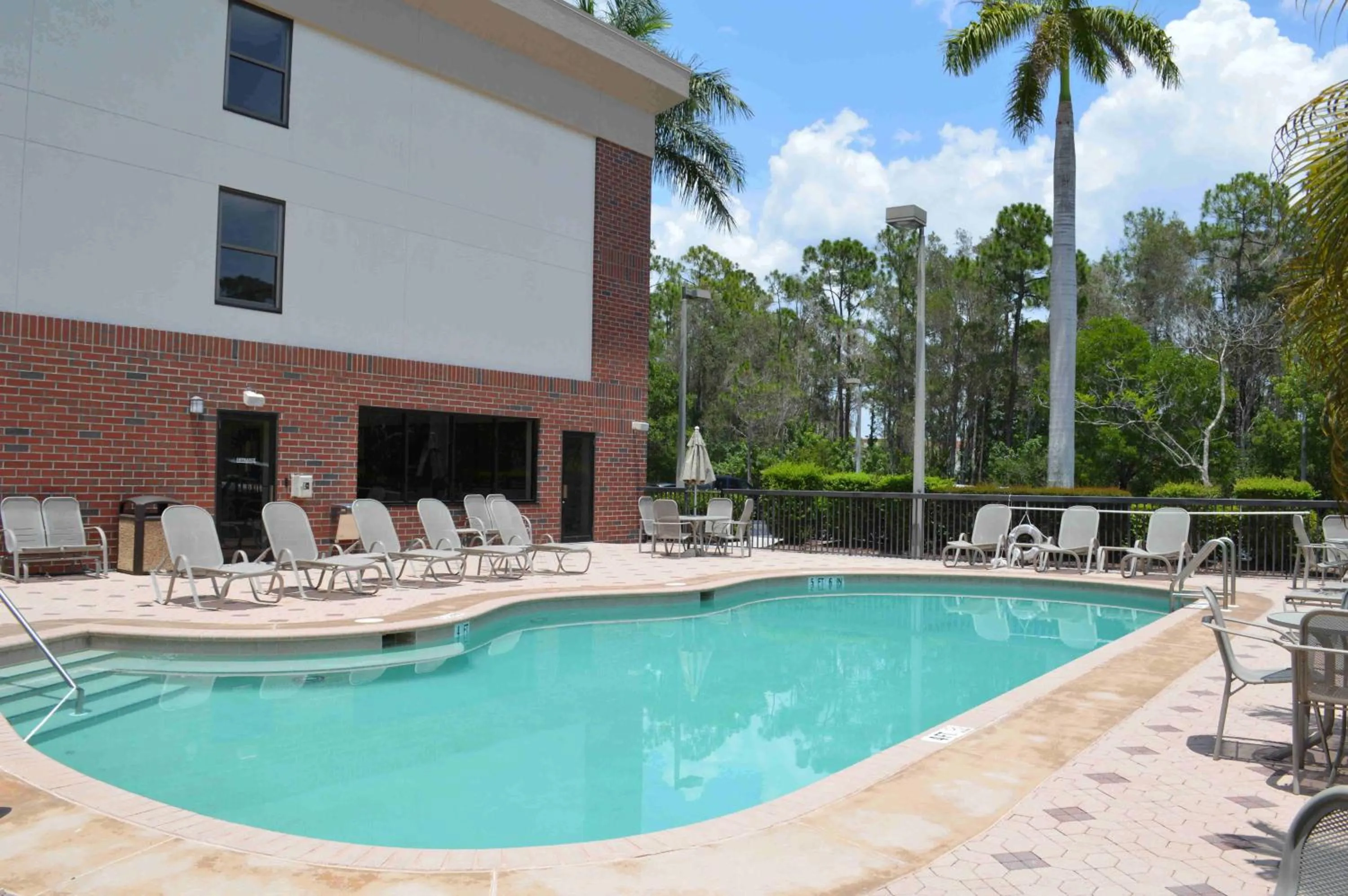 Swimming pool in Days Inn & Suites by Wyndham Fort Myers Near JetBlue Park