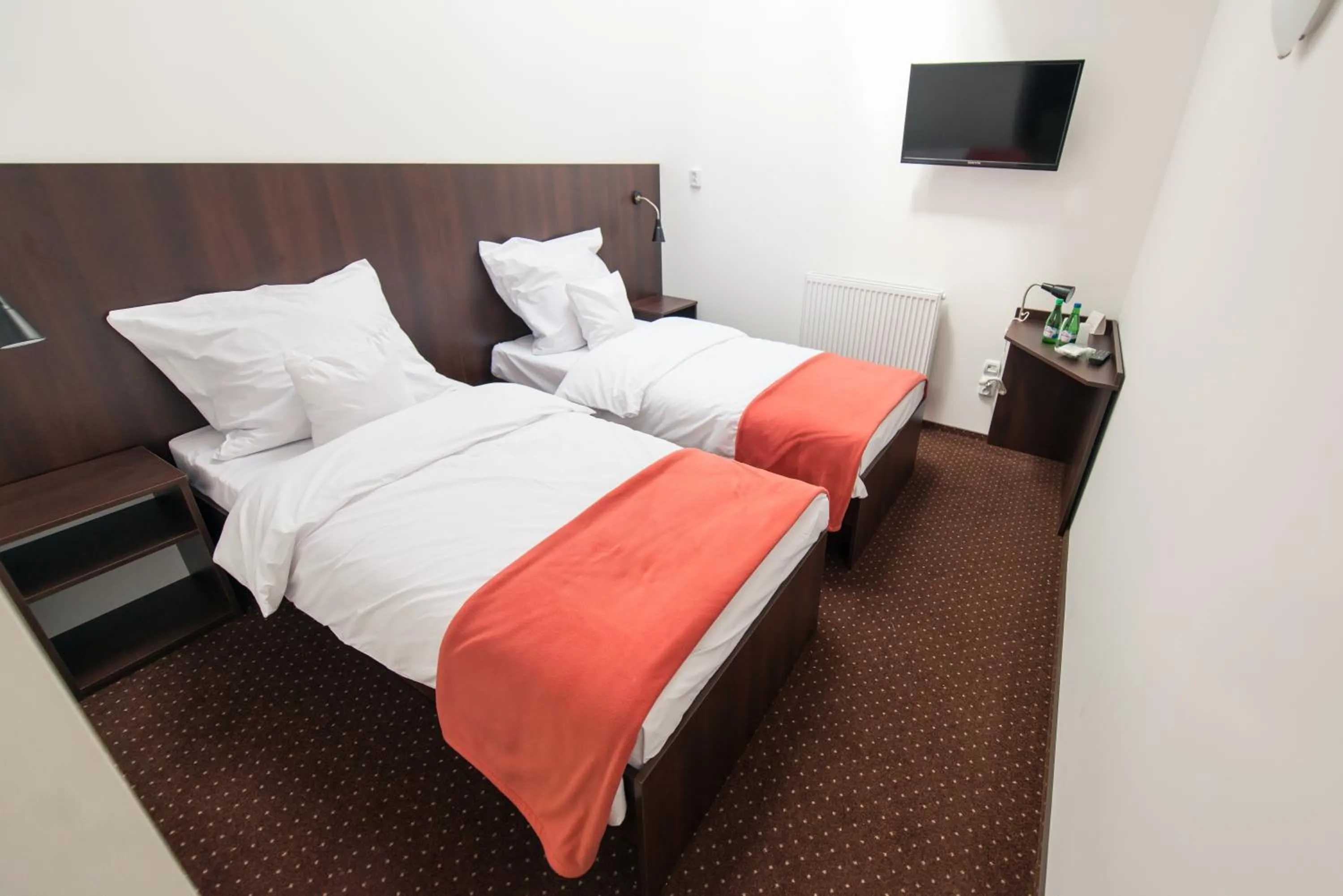 Photo of the whole room, Bed in First Hotel