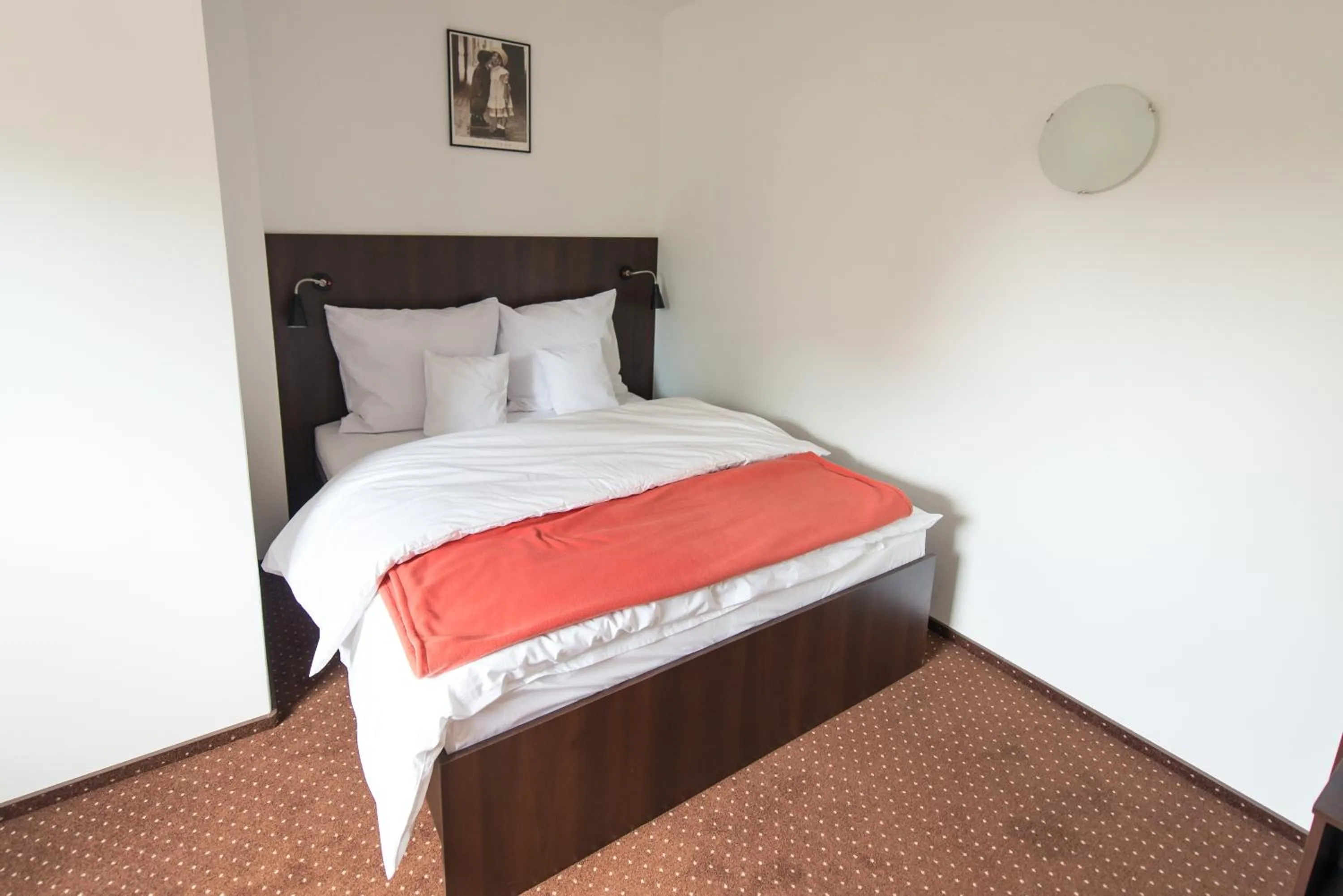 Photo of the whole room, Bed in First Hotel