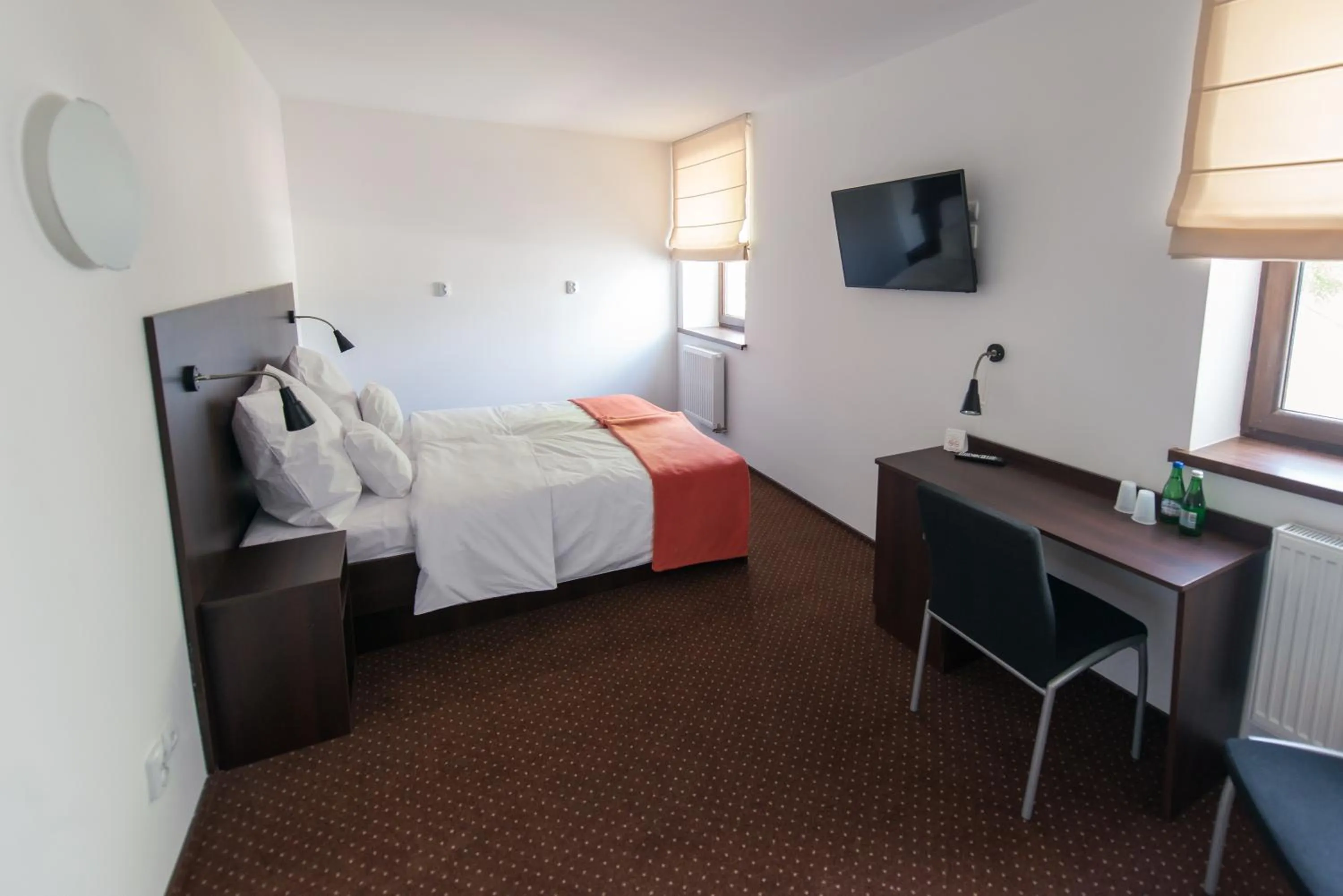 Photo of the whole room, Bed in First Hotel