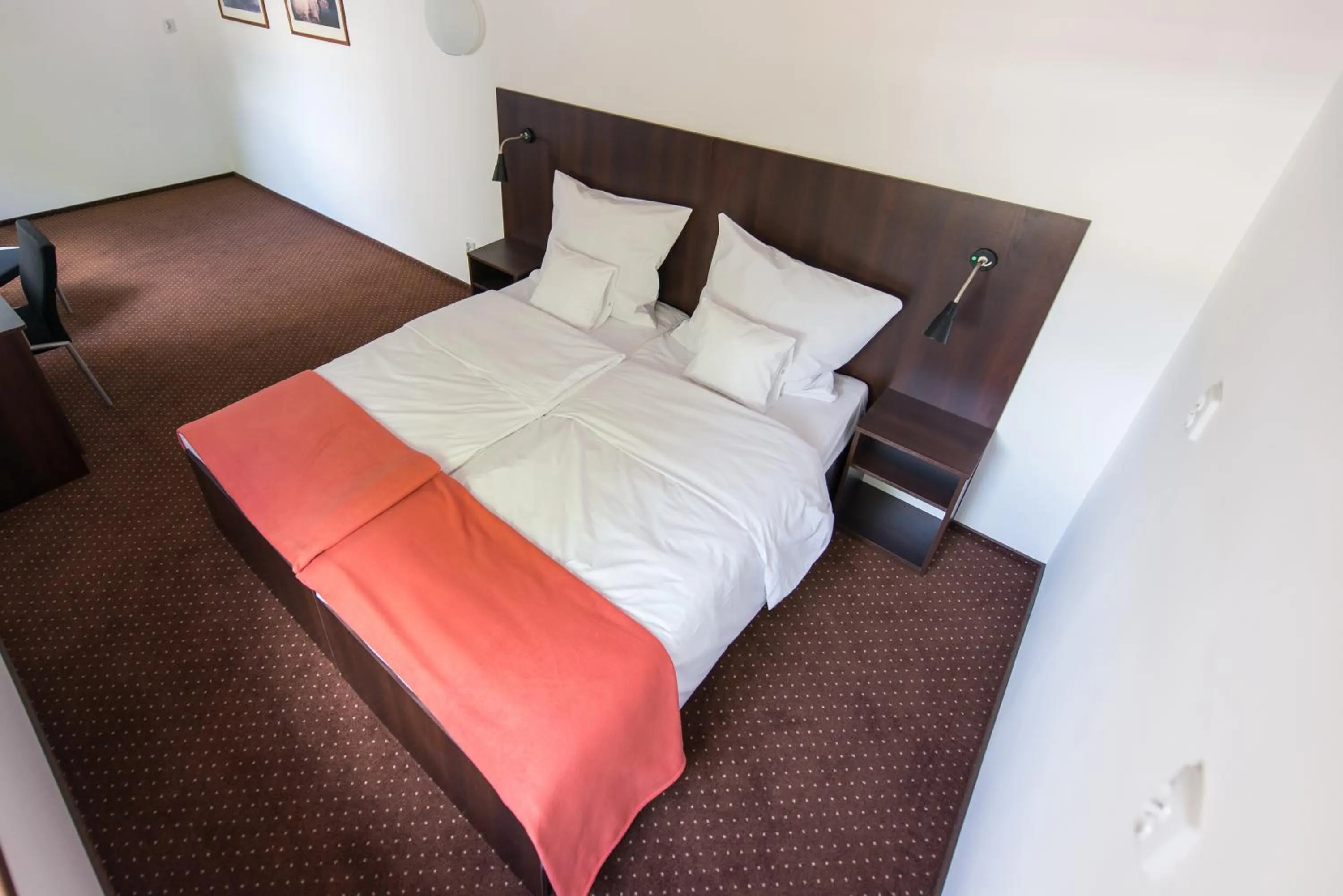 Photo of the whole room, Bed in First Hotel