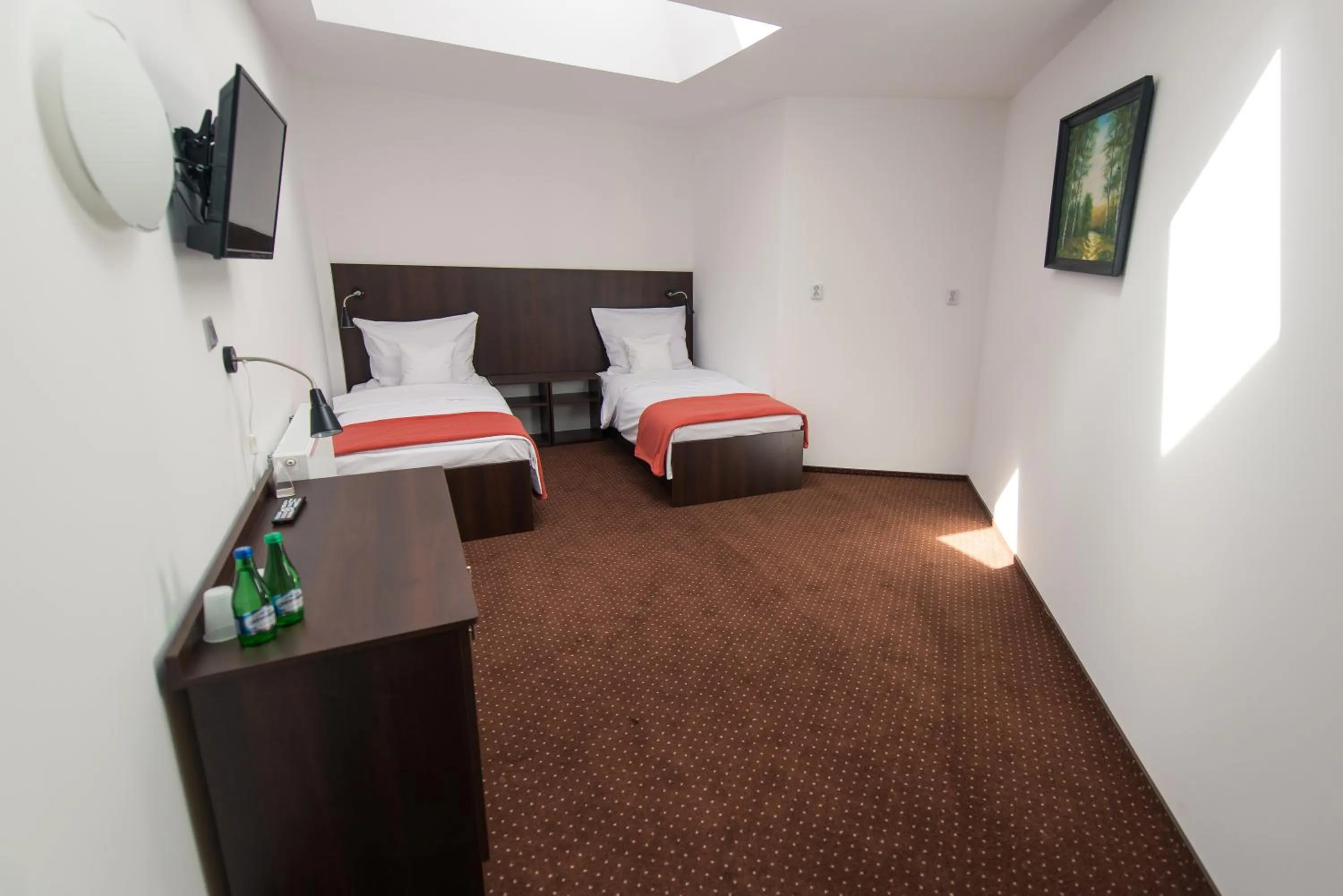 Photo of the whole room, Bed in First Hotel