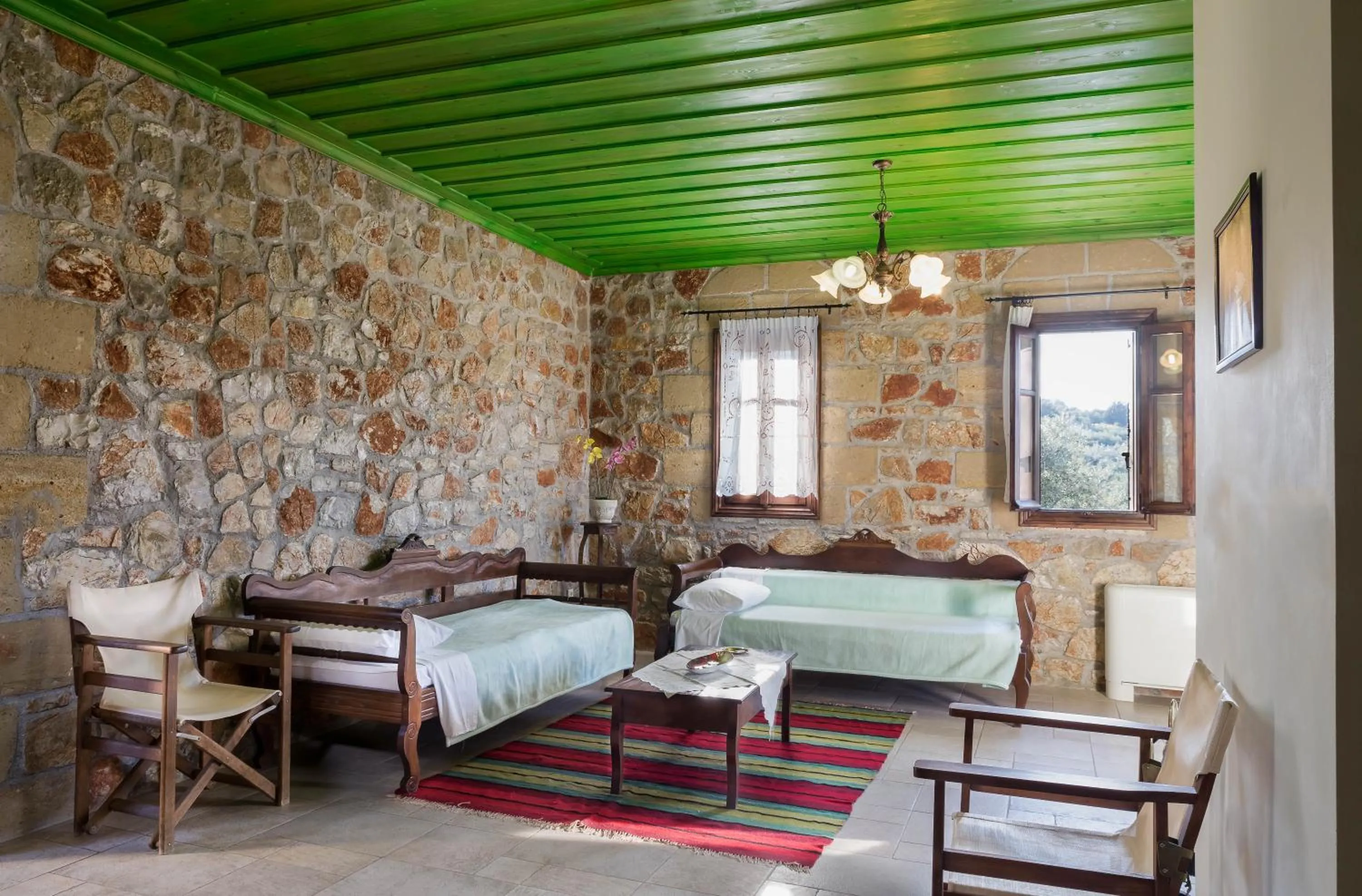 Living room, Bed in Klymeni Traditional Homes