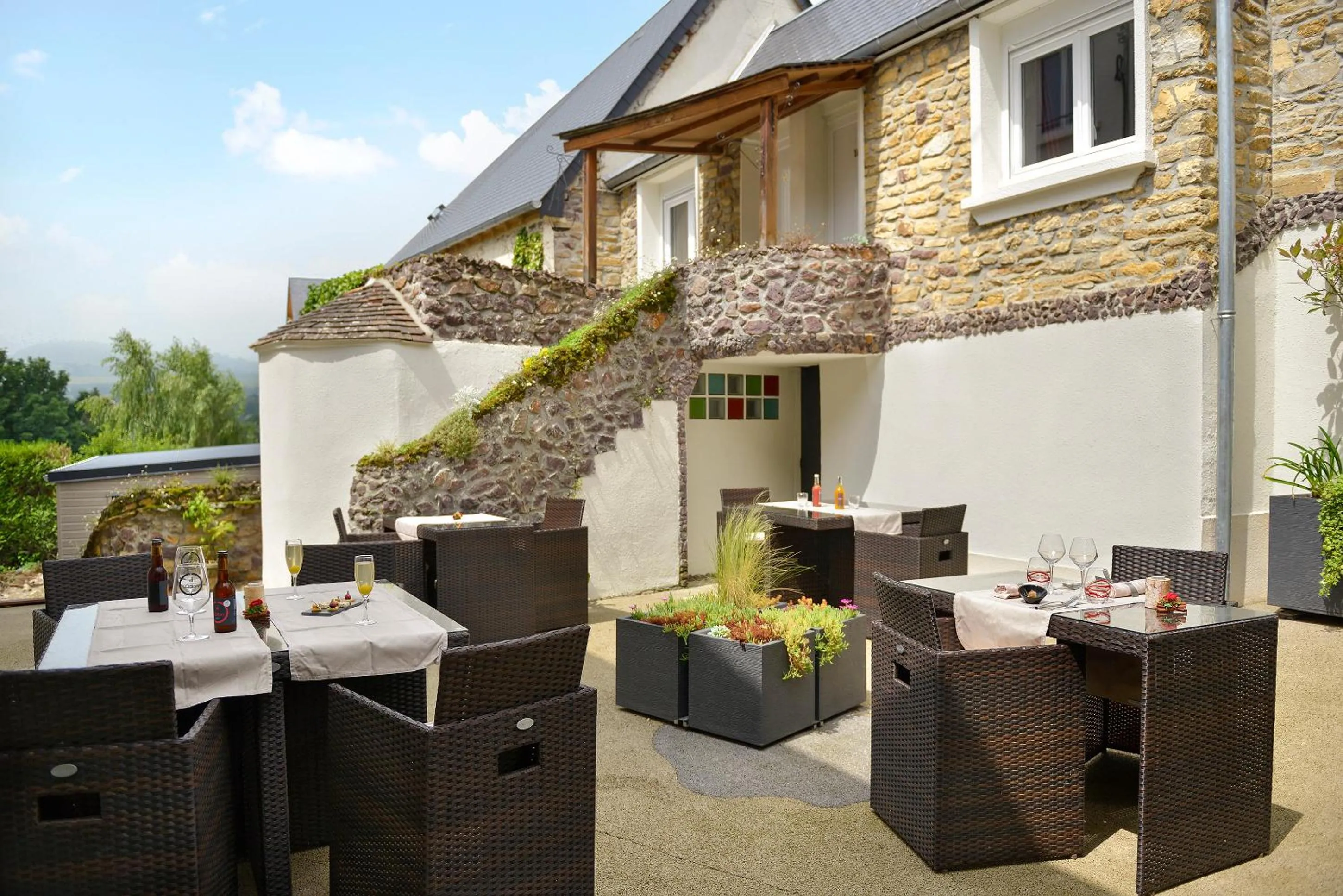 Patio in Logis Hotel Spa Restaurant Au Site Normand