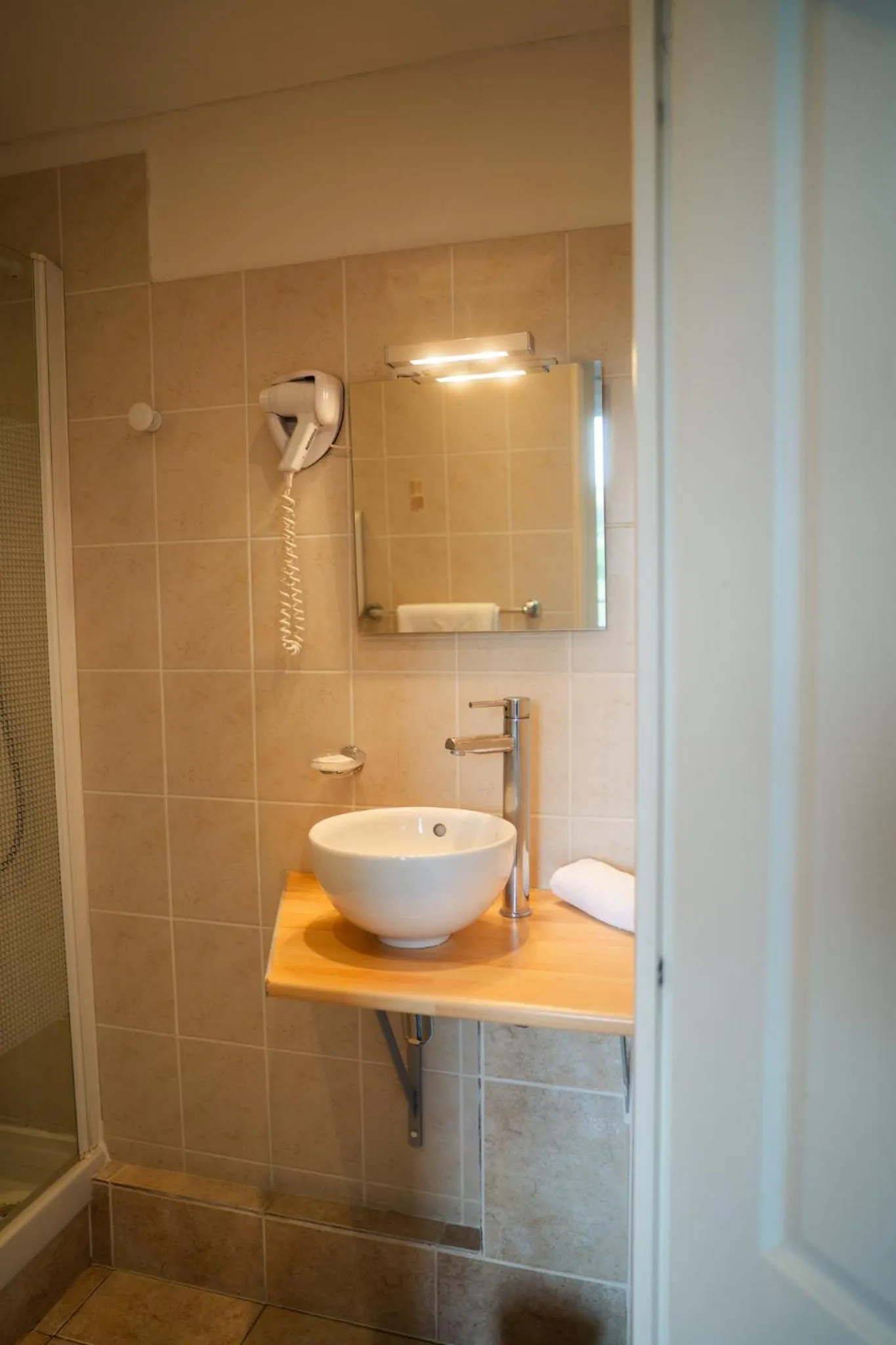 Bathroom in Logis Hotel Spa Restaurant Au Site Normand