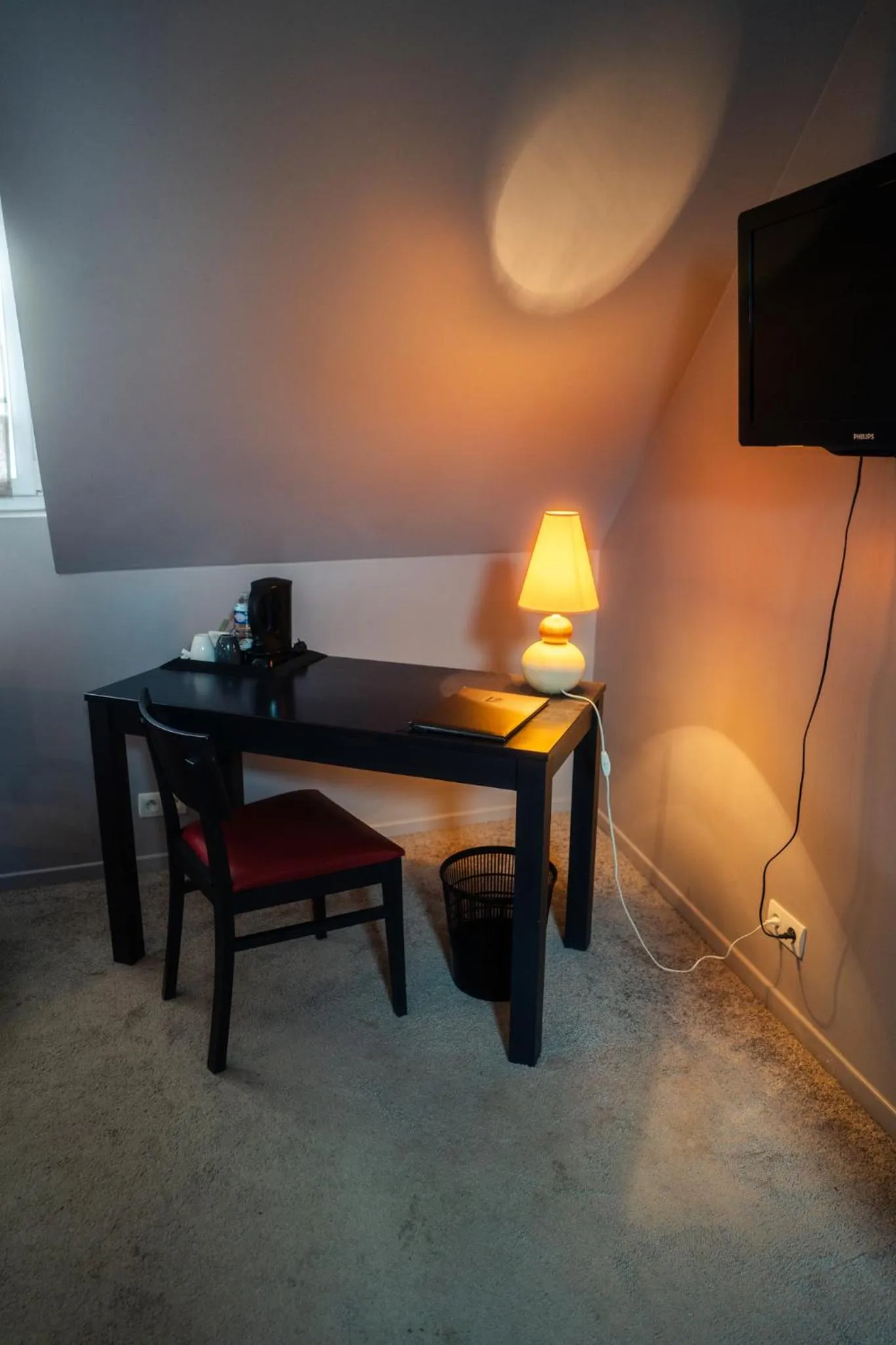 TV and multimedia in Logis Hotel Spa Restaurant Au Site Normand