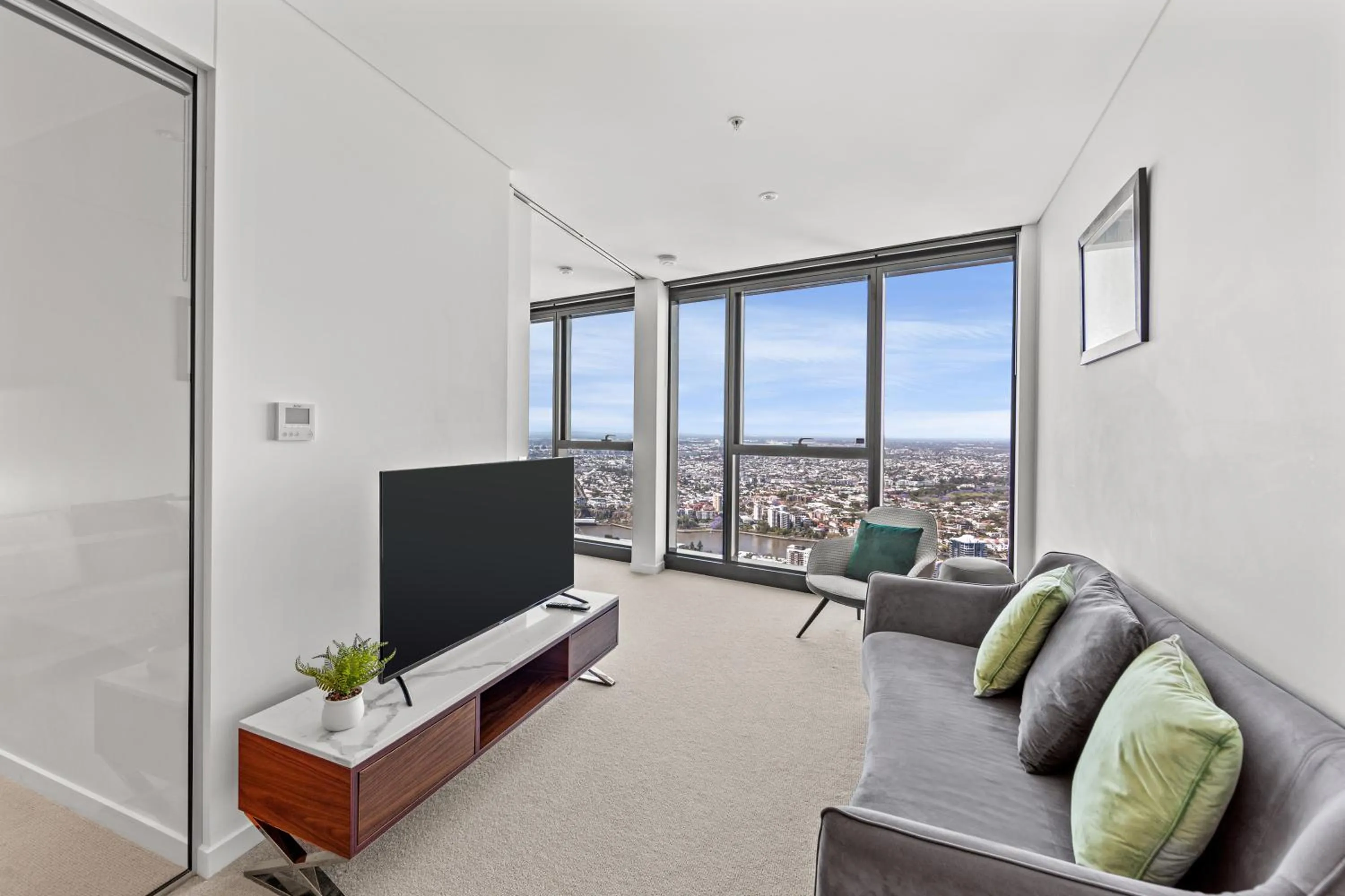 Living room in Brisbane Skytower by CLLIX