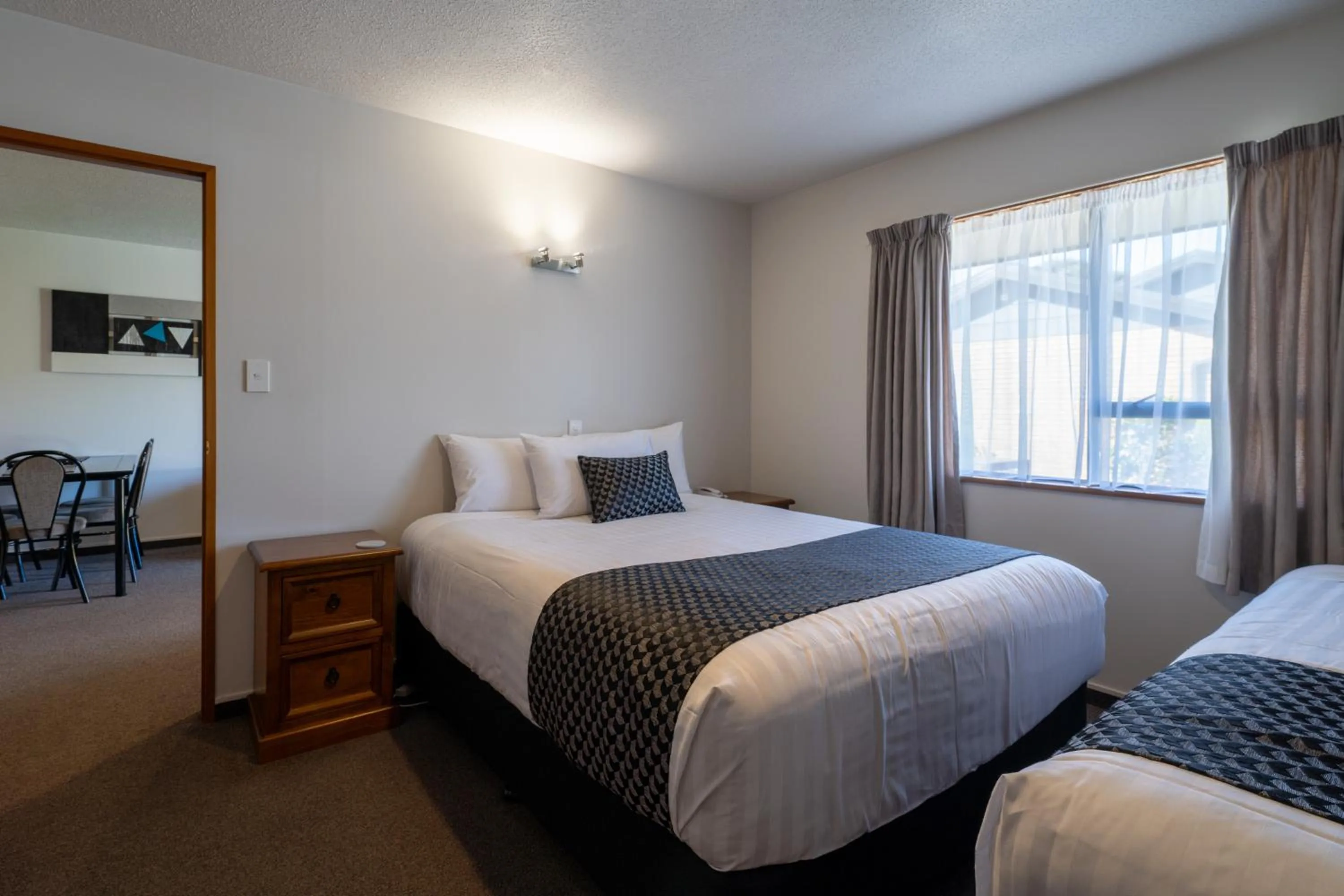 Bed in ASURE Highpark Motor Inn