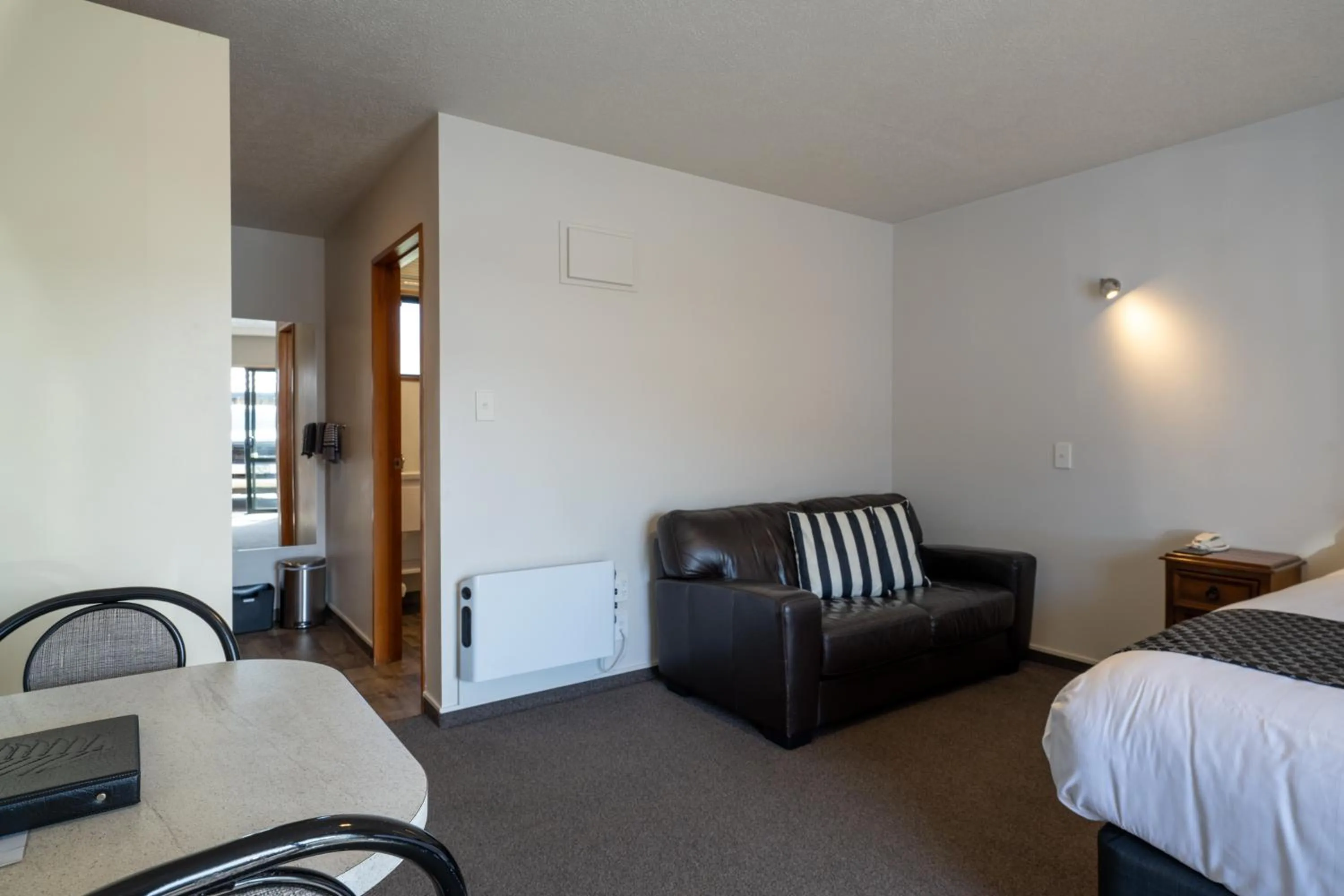 Bed in ASURE Highpark Motor Inn