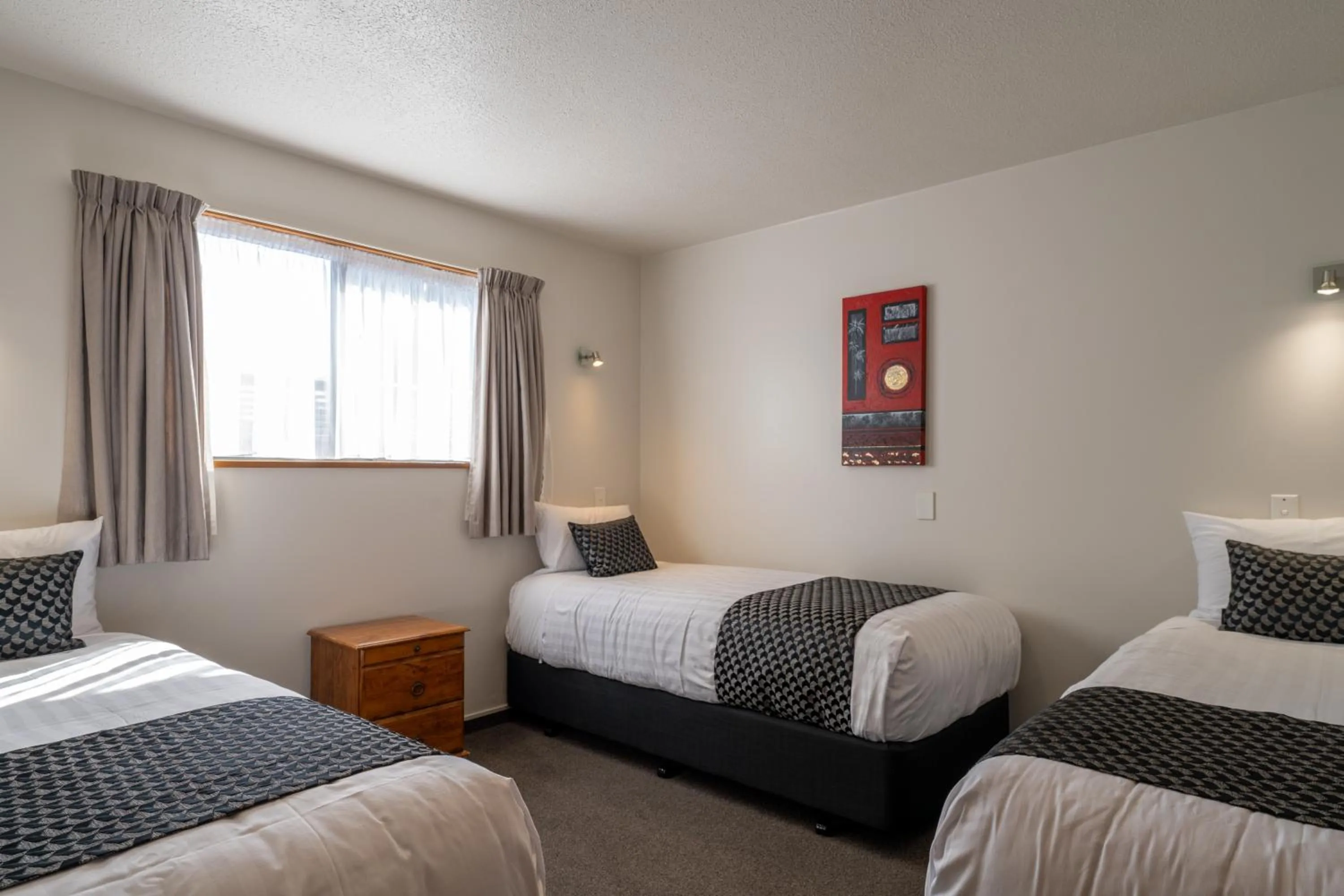 Bed in ASURE Highpark Motor Inn