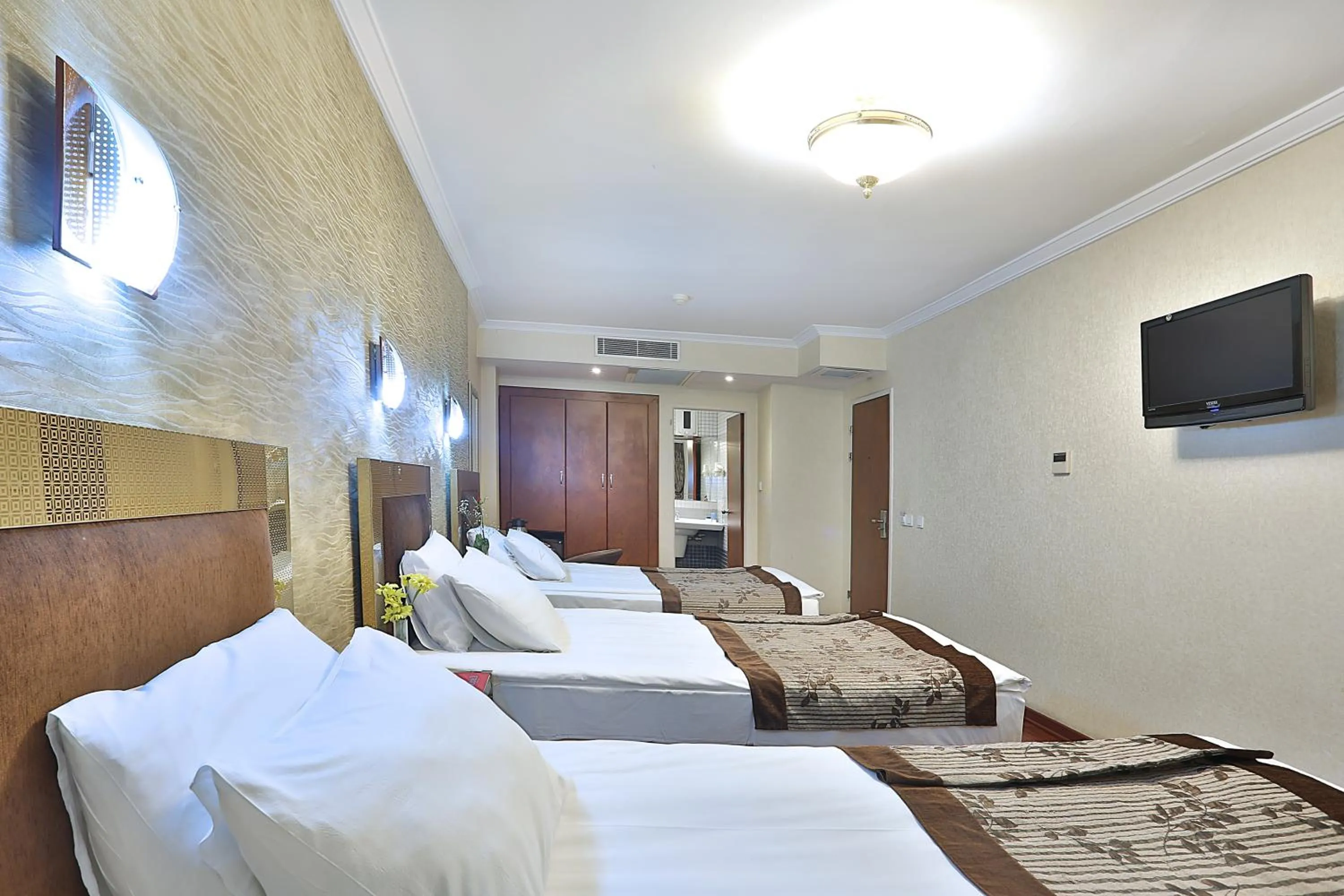 Bed in Grand Madrid Hotel