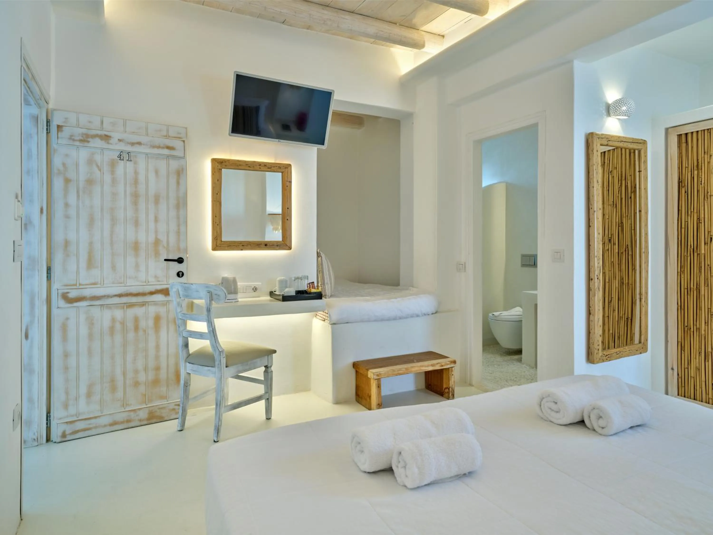 Bed in Zefi Hotel & Suites