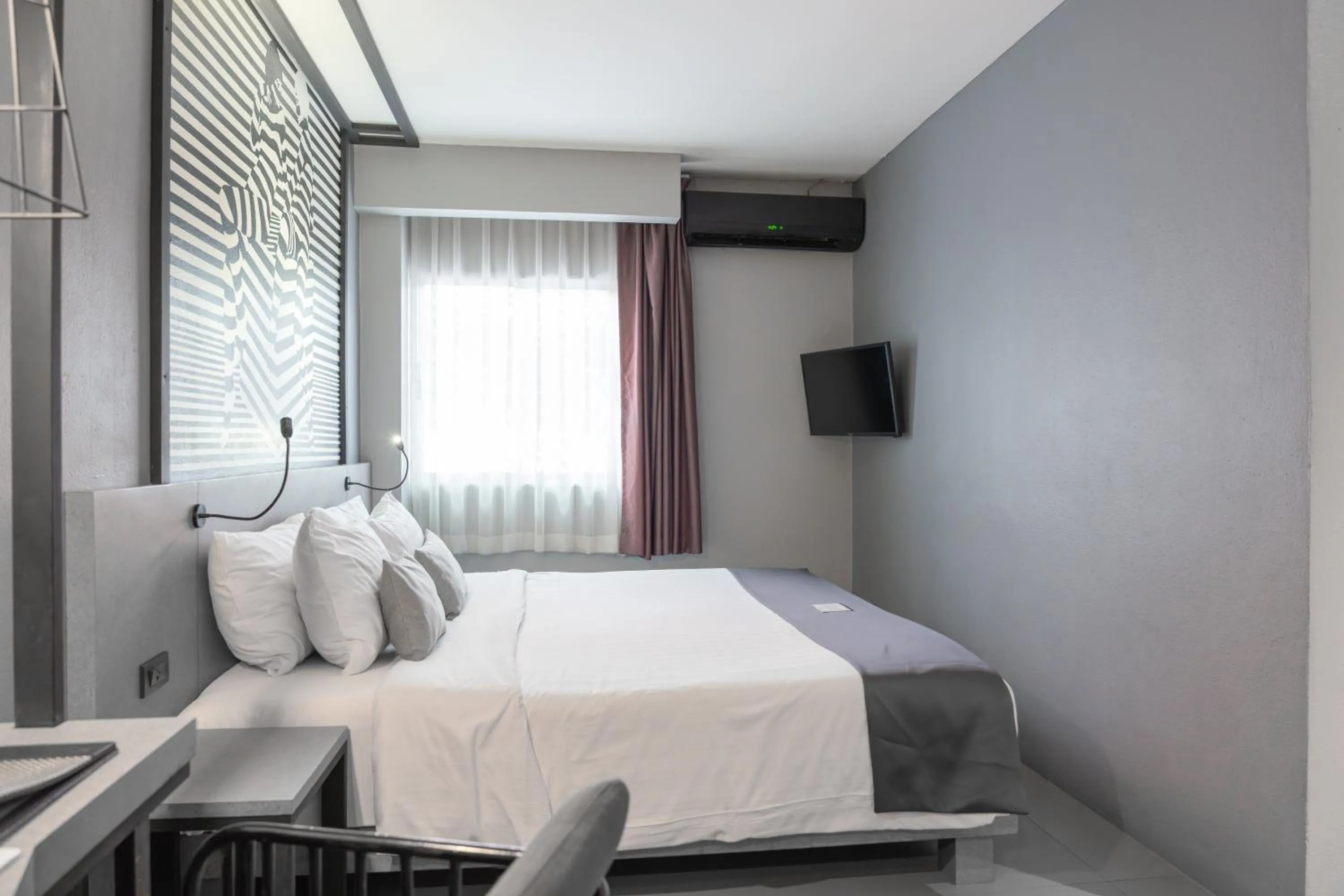 Bed in Mazi Design Hotel by Kalima