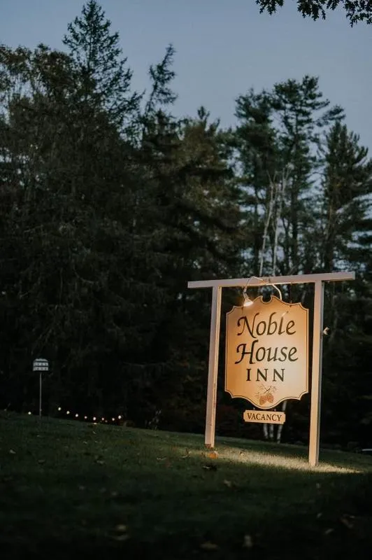 Property logo or sign in Noble House Inn