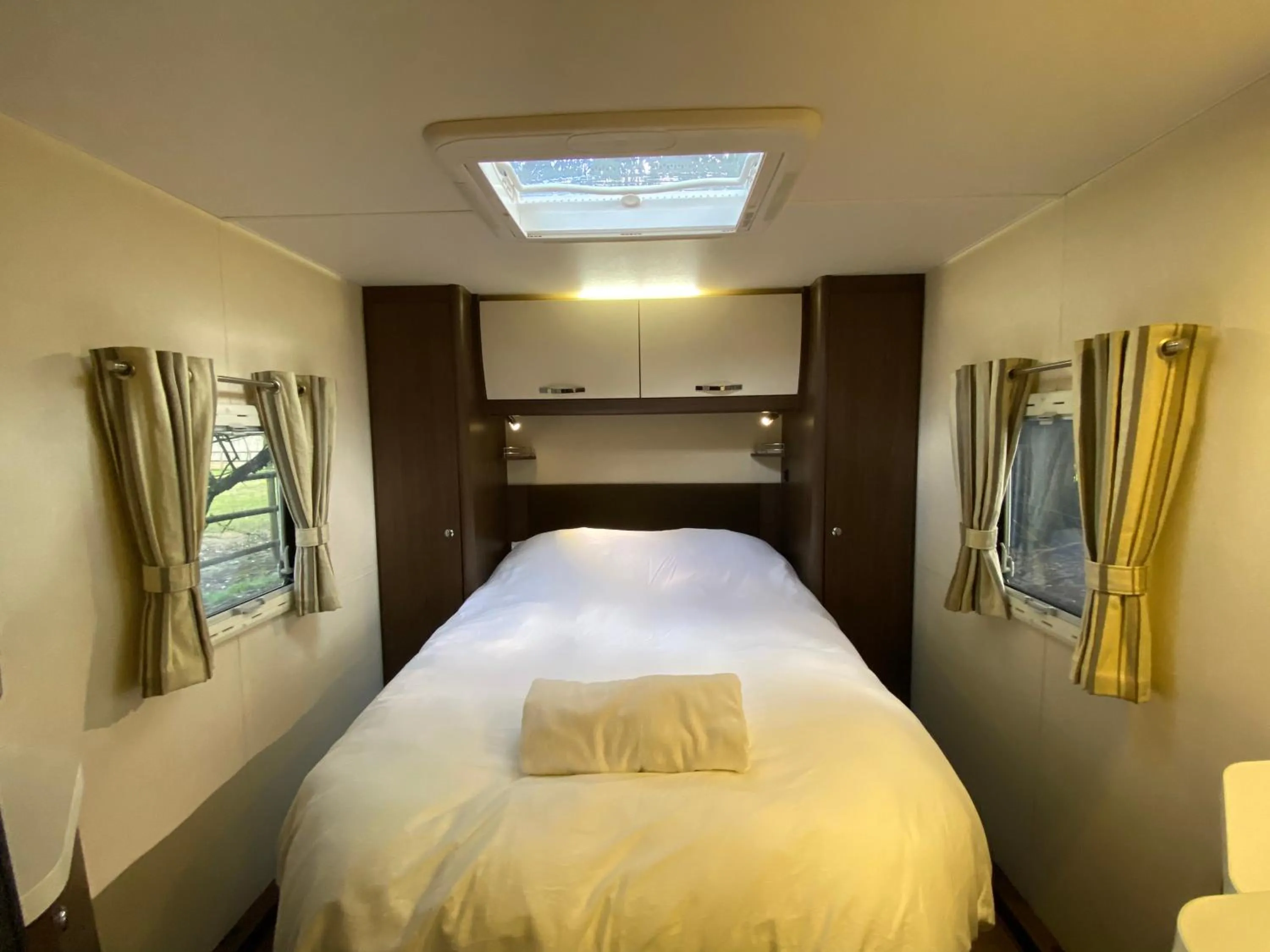 Bedroom in The Secret Cottage & Hideaway Caravan