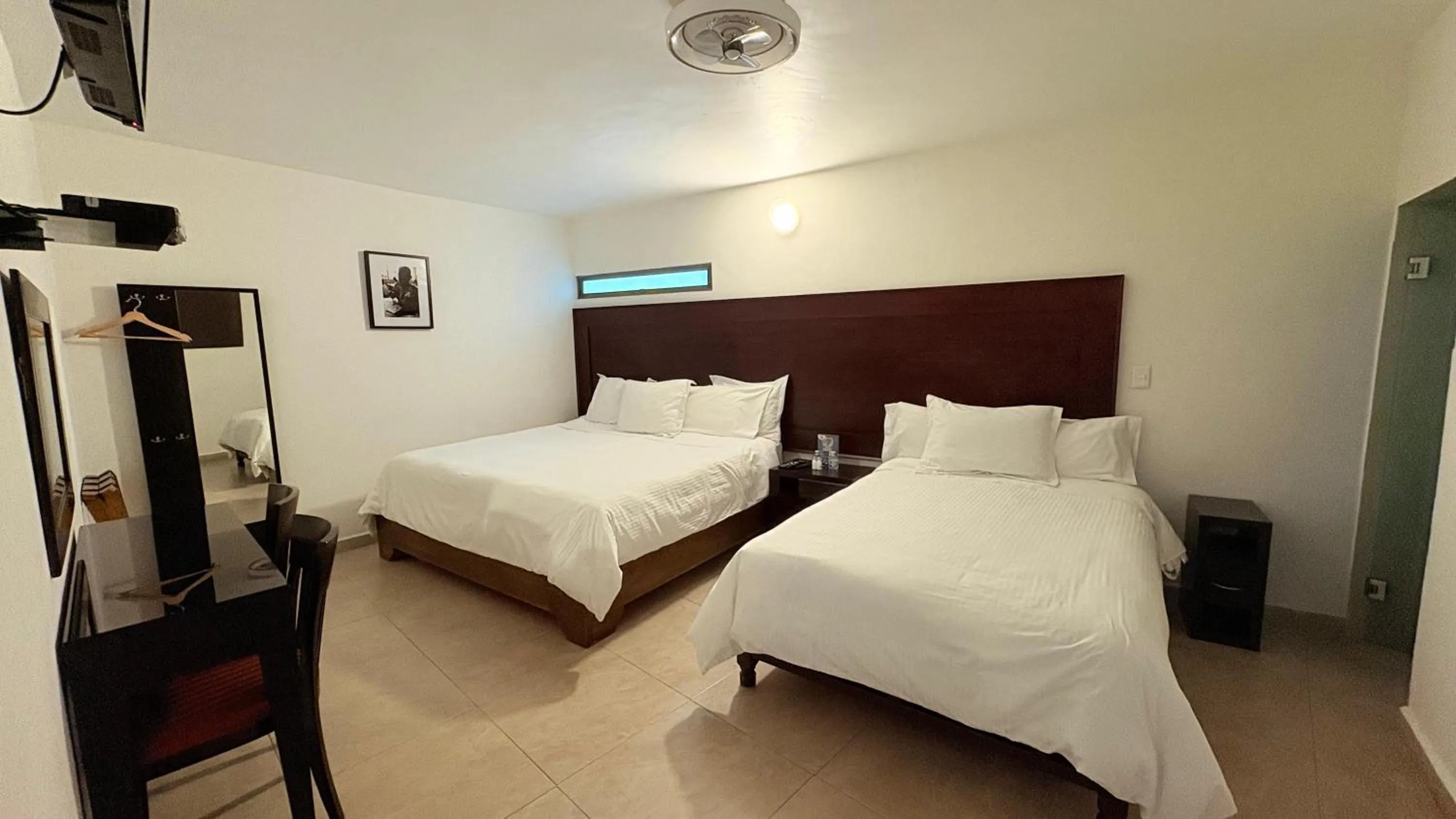 Bed in Hotel Boutique Yaocalli