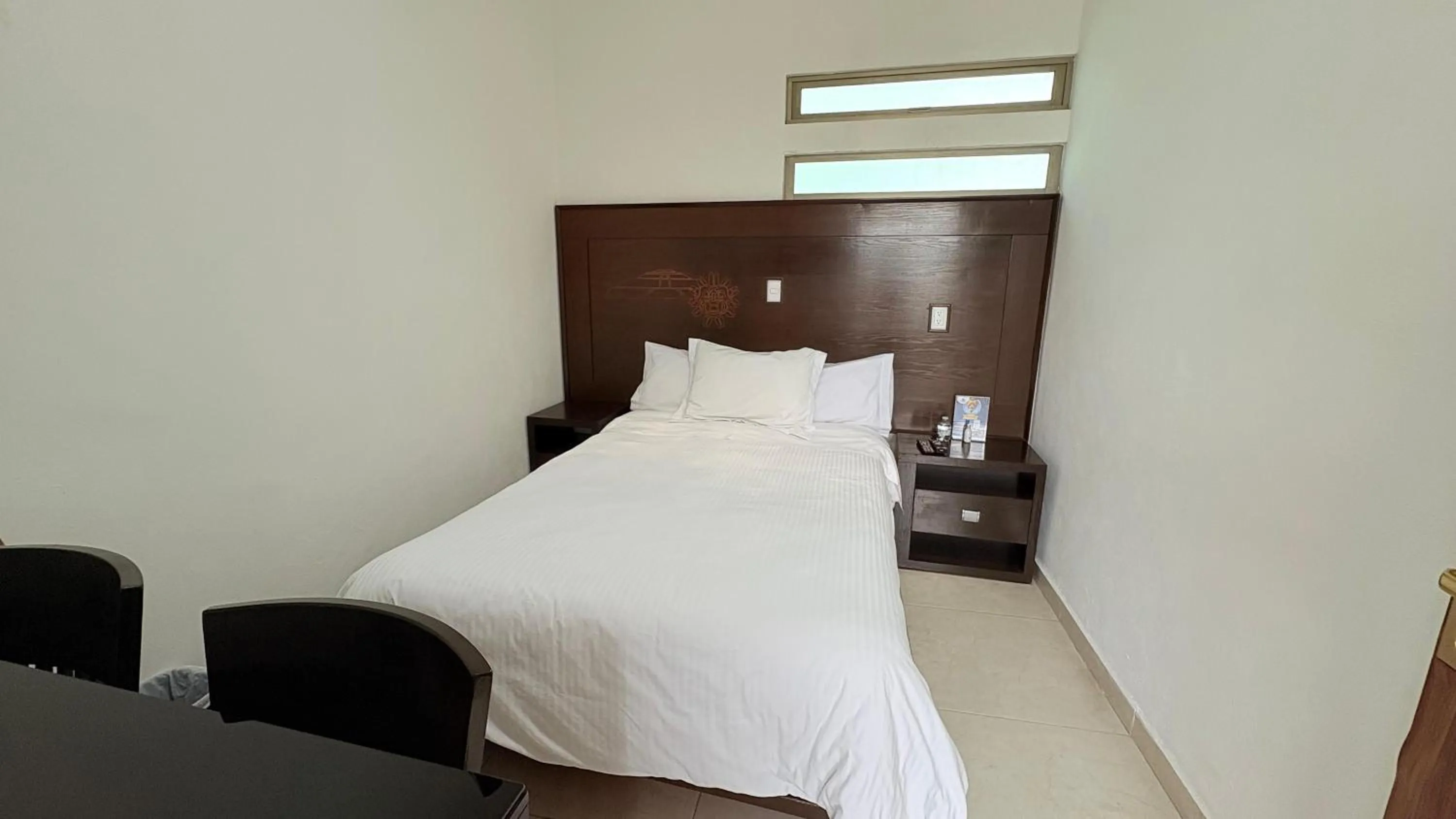 Bed in Hotel Boutique Yaocalli