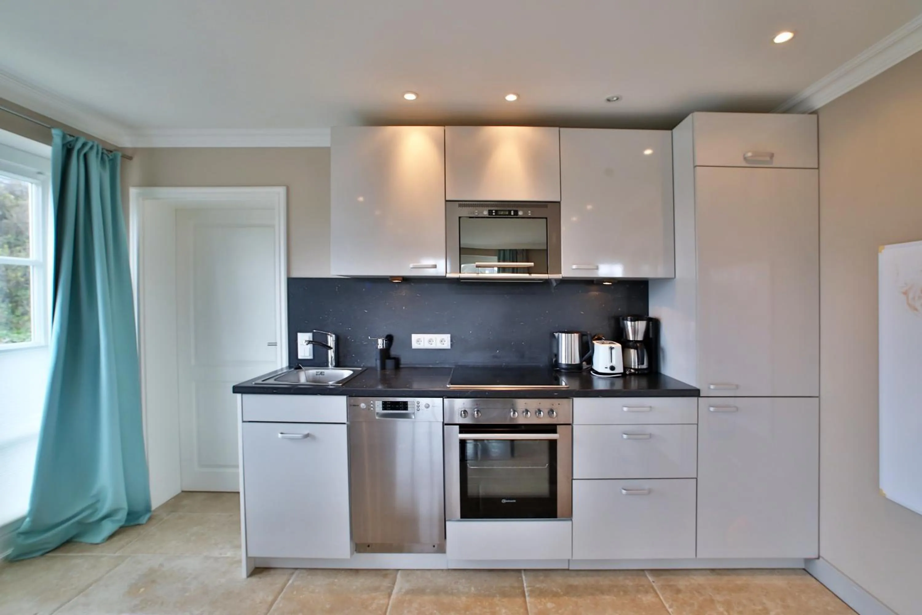 Kitchen or kitchenette in ApartHotel Seepferdchen