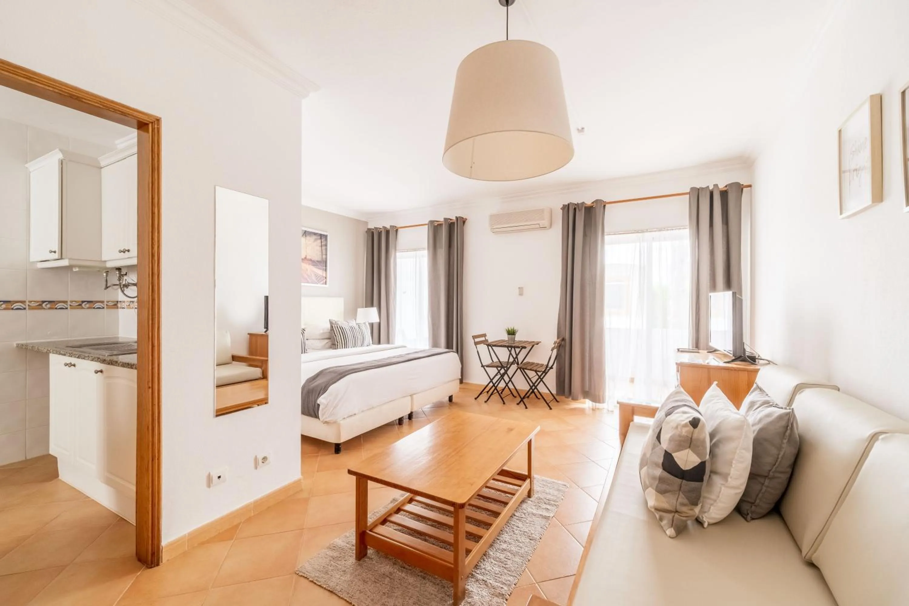 Bed in Oasis Beach Apartments