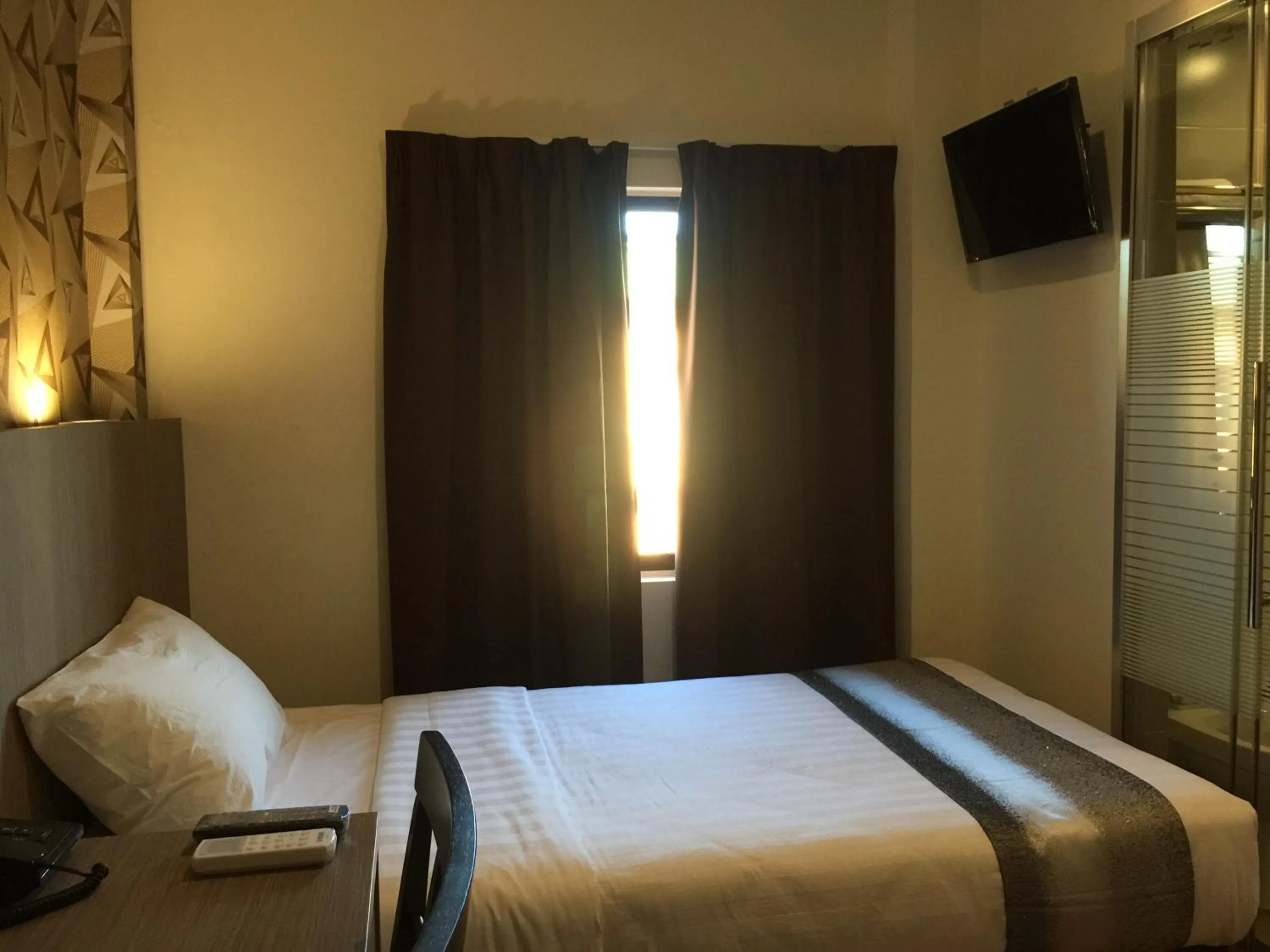 Bed in Check Inn Hotel Tawau