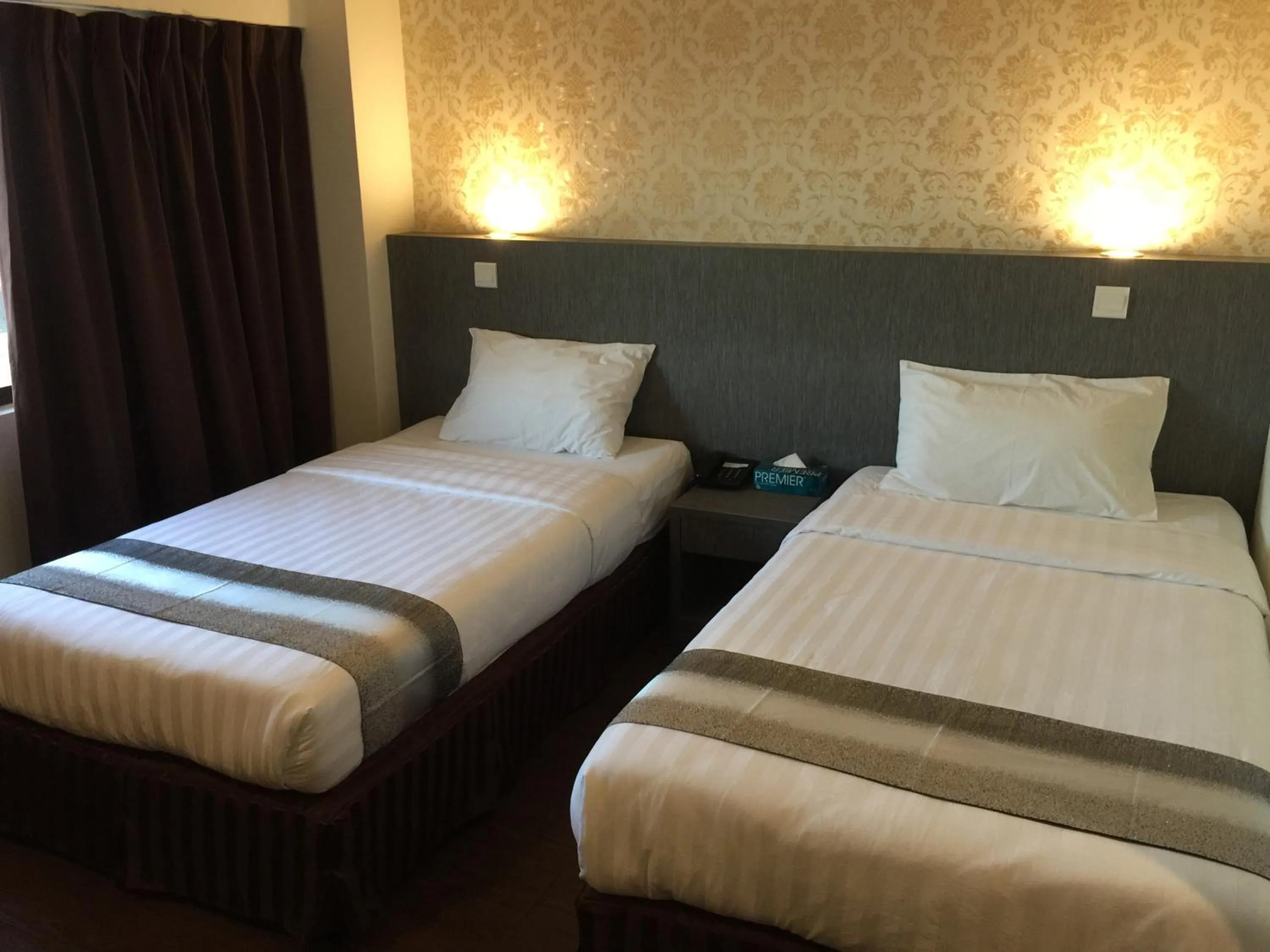 Bed in Check Inn Hotel Tawau