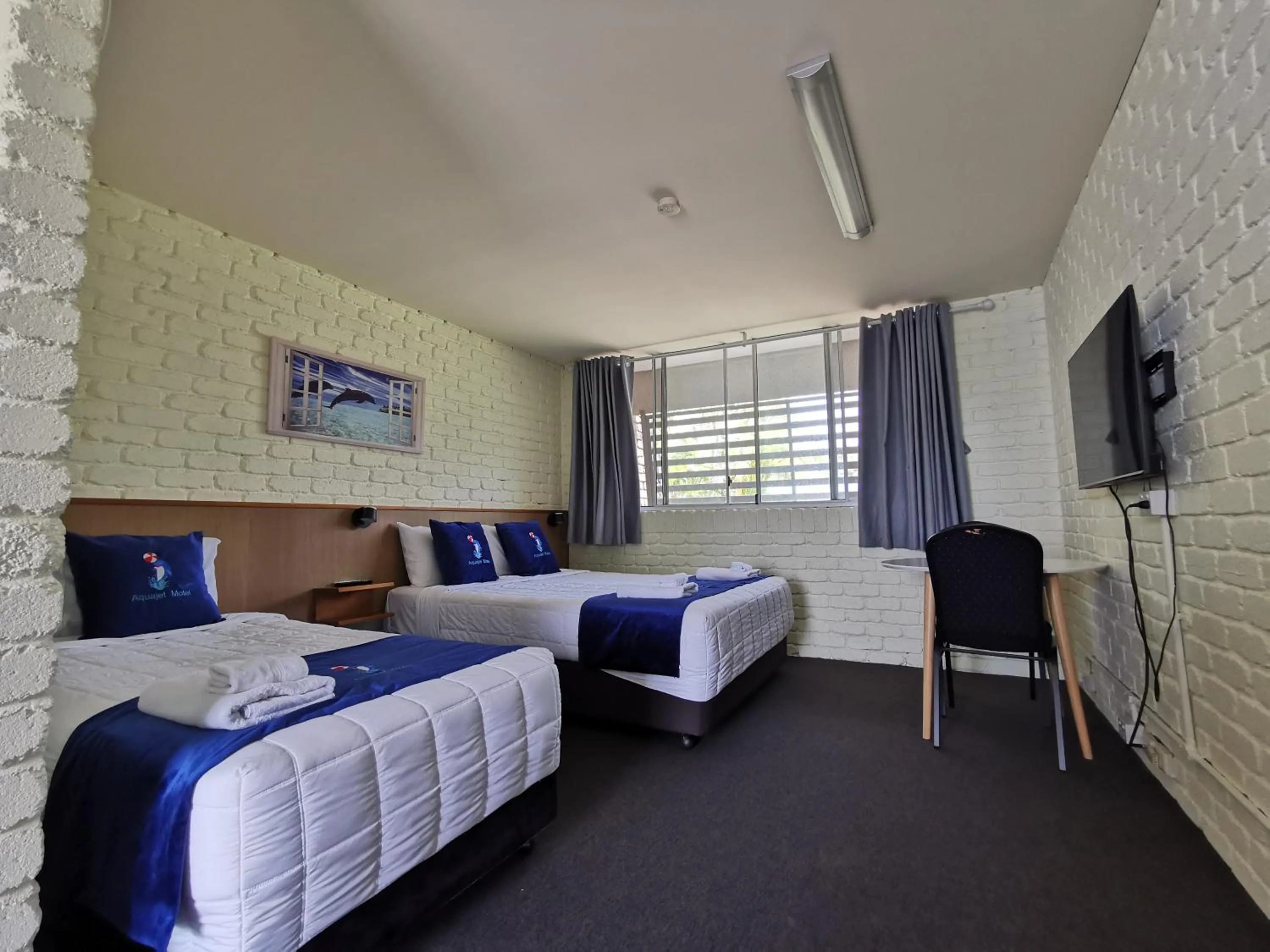 Bed in Aquajet Motel