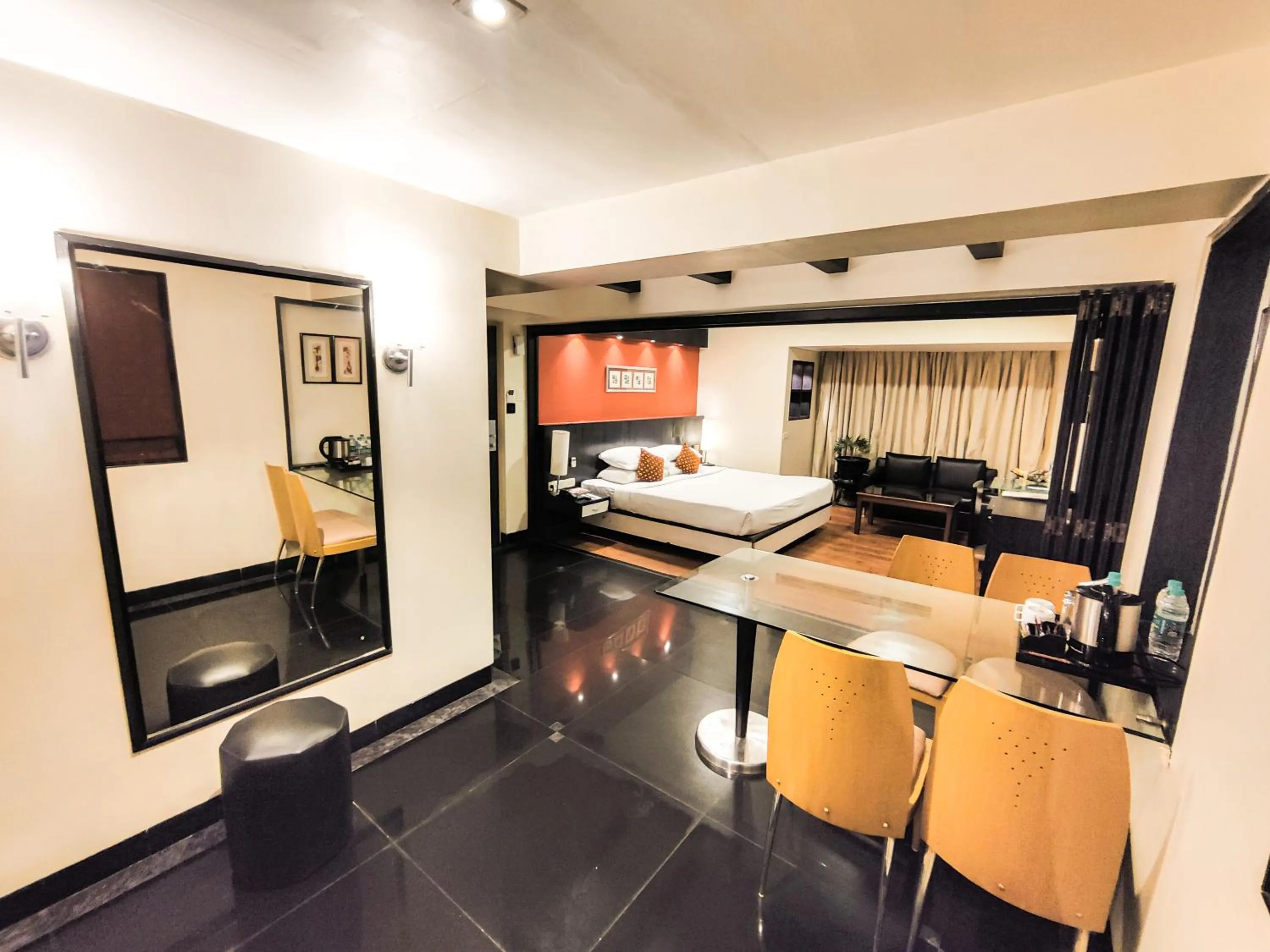 Seating area, Bed in Ramee Guestline Hotel Khar