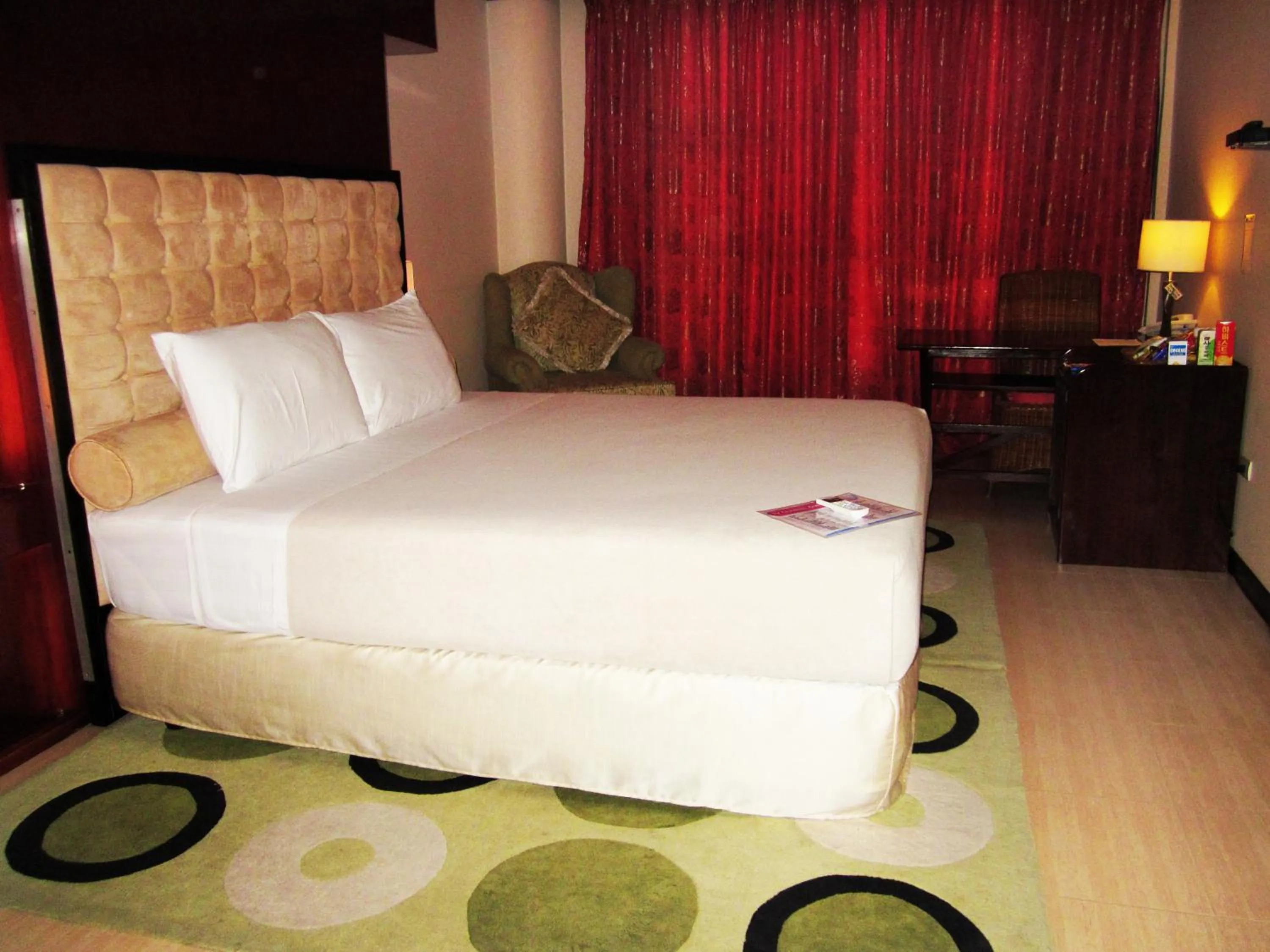 Photo of the whole room, Bed in Cebu Dulcinea Hotel and Suites-MACTAN AIRPORT HOTEL