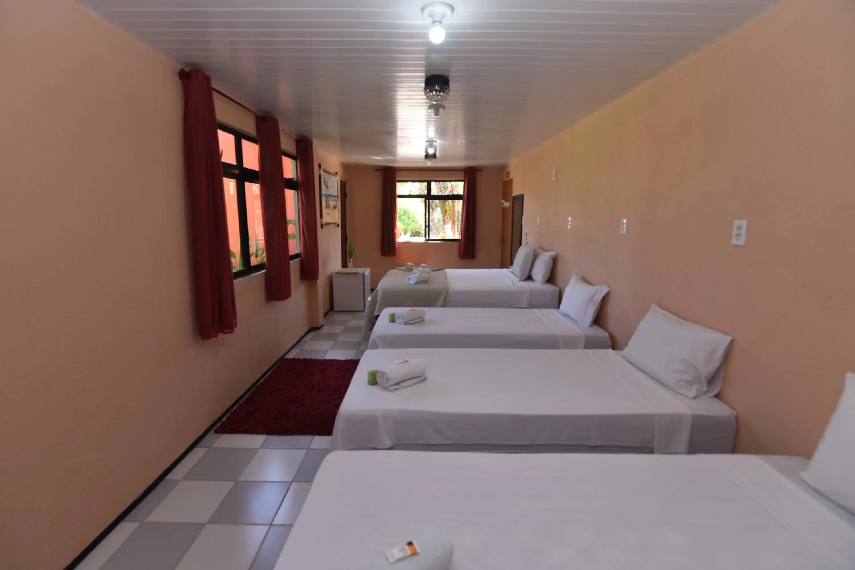 Bed in Pousada Brasil Cumbuco