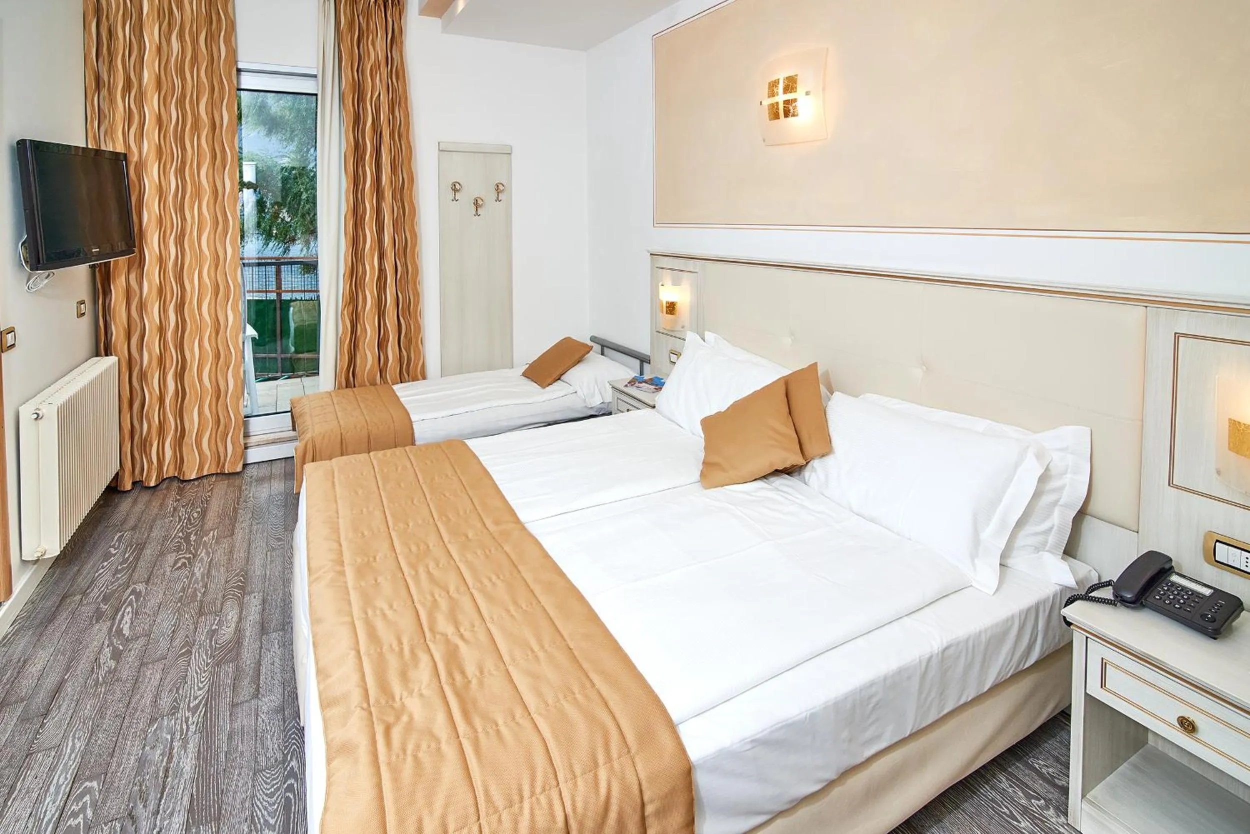 Garden view, Bed in Hotel Lido Blu - Surf & Bike