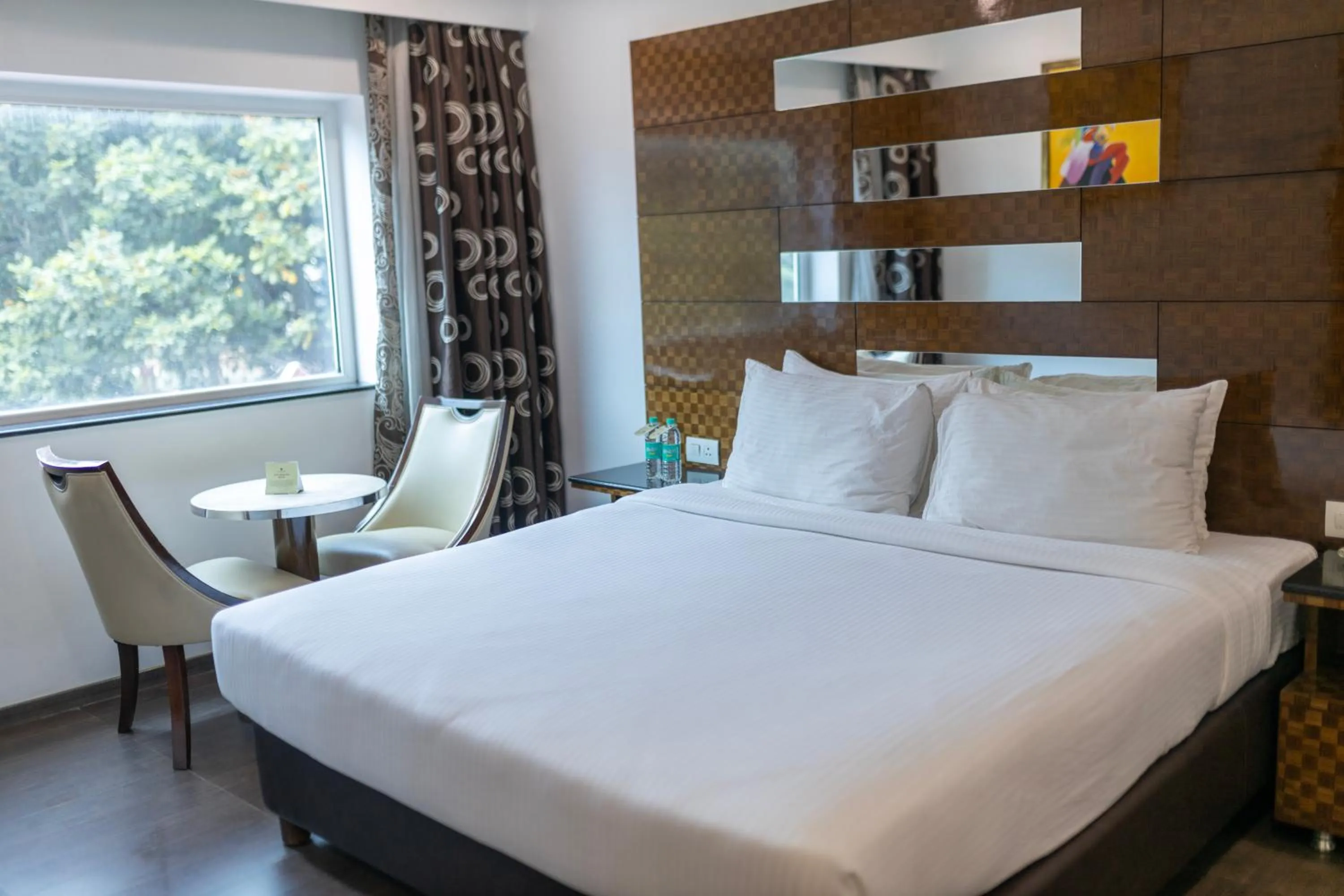 Bed in Ramee Guestline Hotel Bangalore