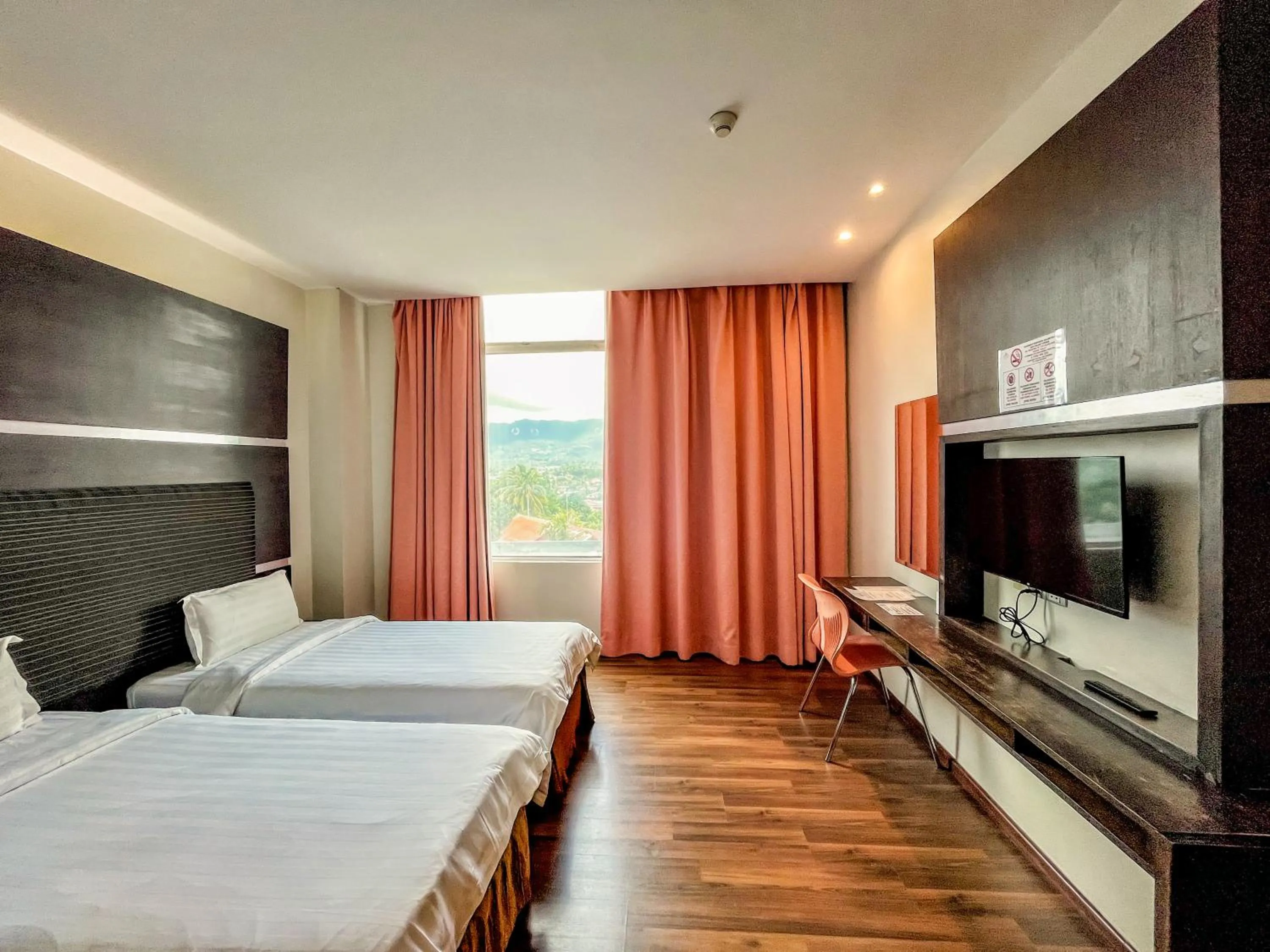 Bed in Courtyard Hotel 1Borneo