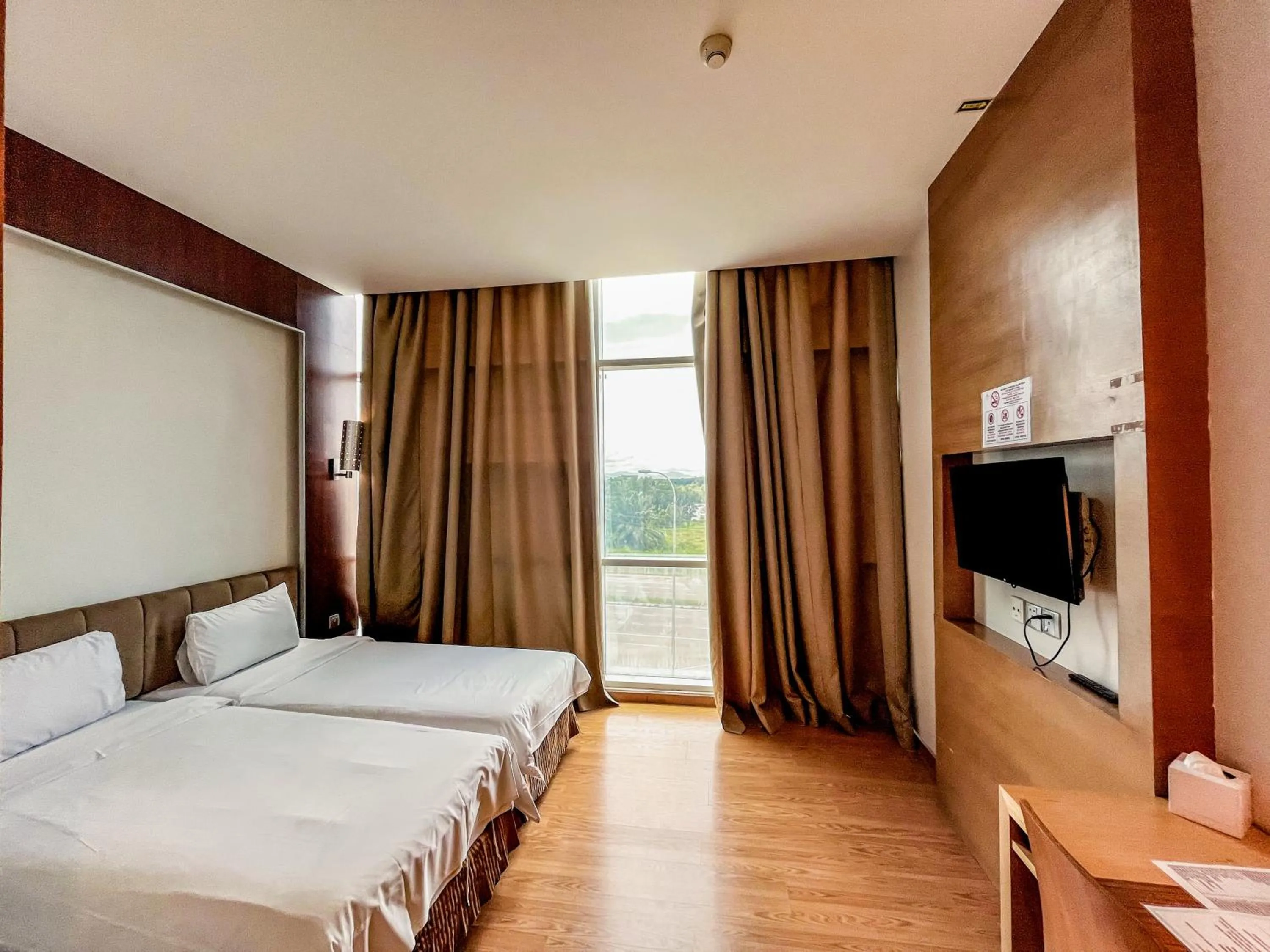 Bed in Courtyard Hotel 1Borneo