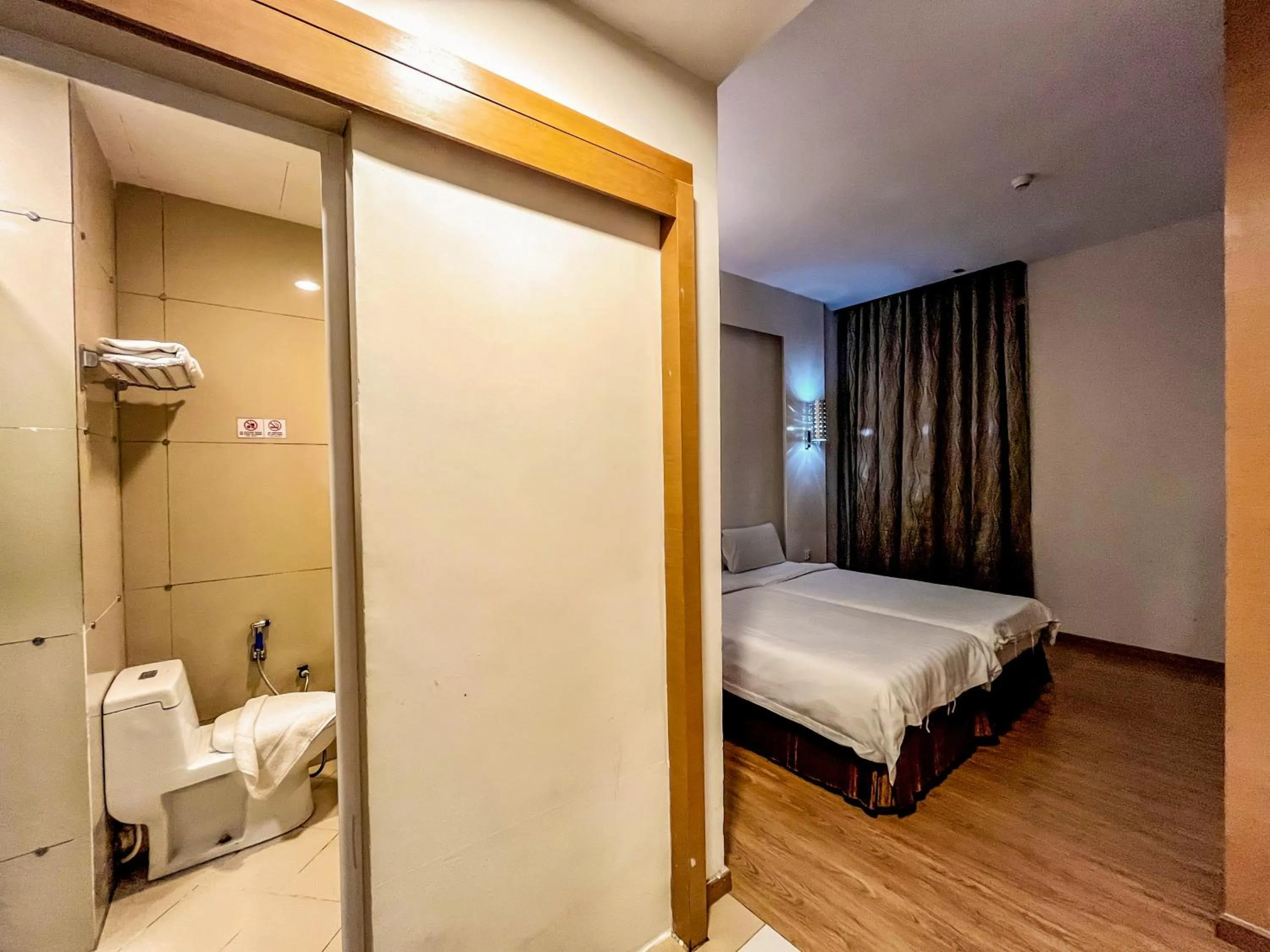 Toilet, Bed in Courtyard Hotel 1Borneo