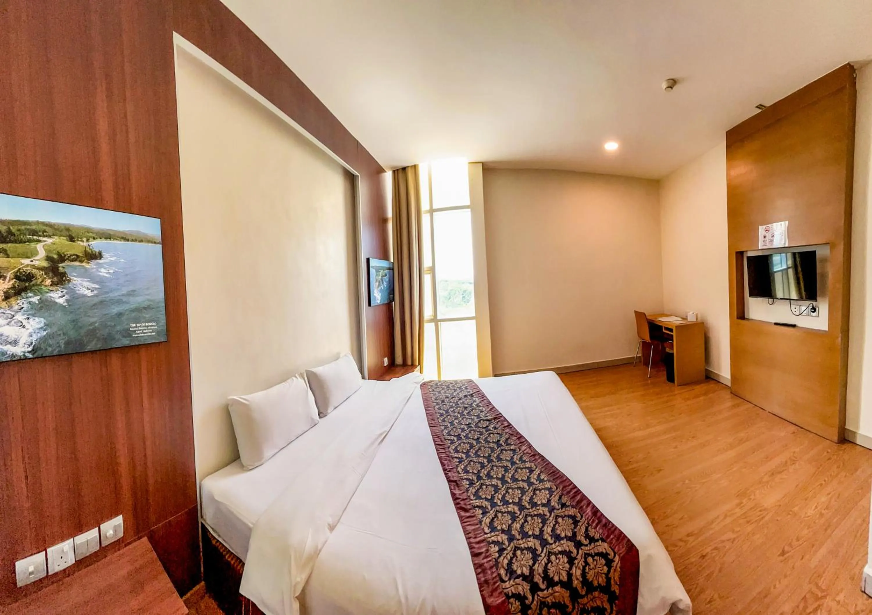 Bed in Courtyard Hotel 1Borneo