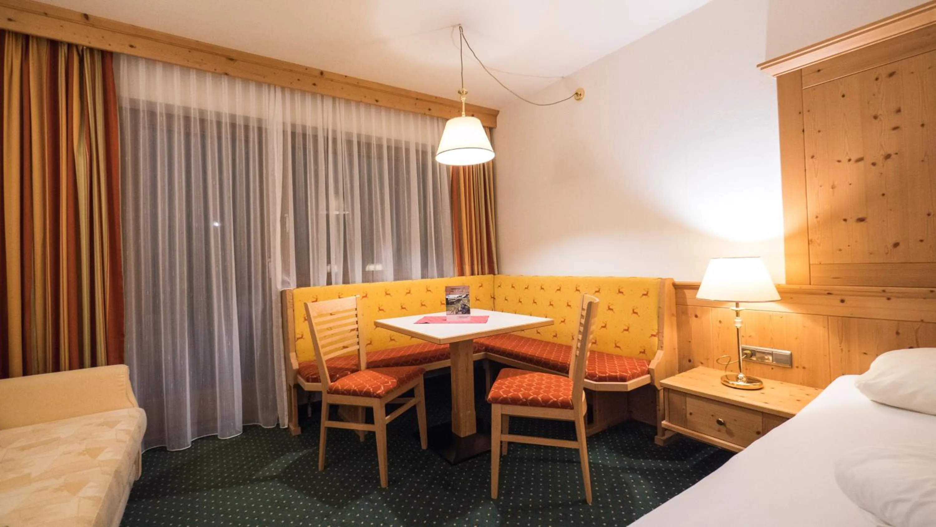 Photo of the whole room, Bed in Hotel Alphof Alpbach