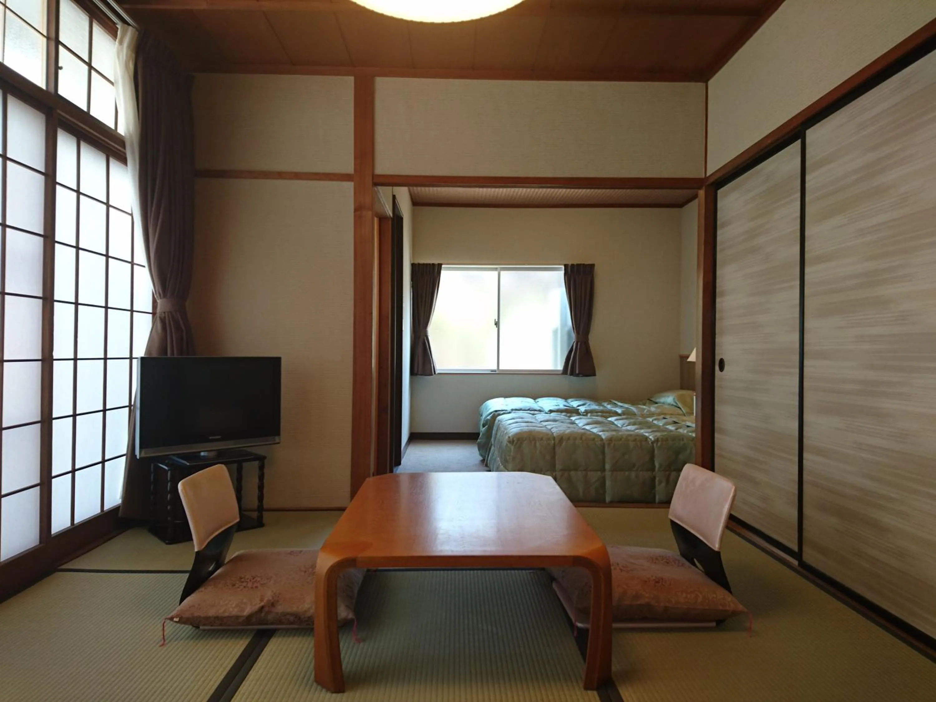 Bed in Onsen Guest House Aobato no Su