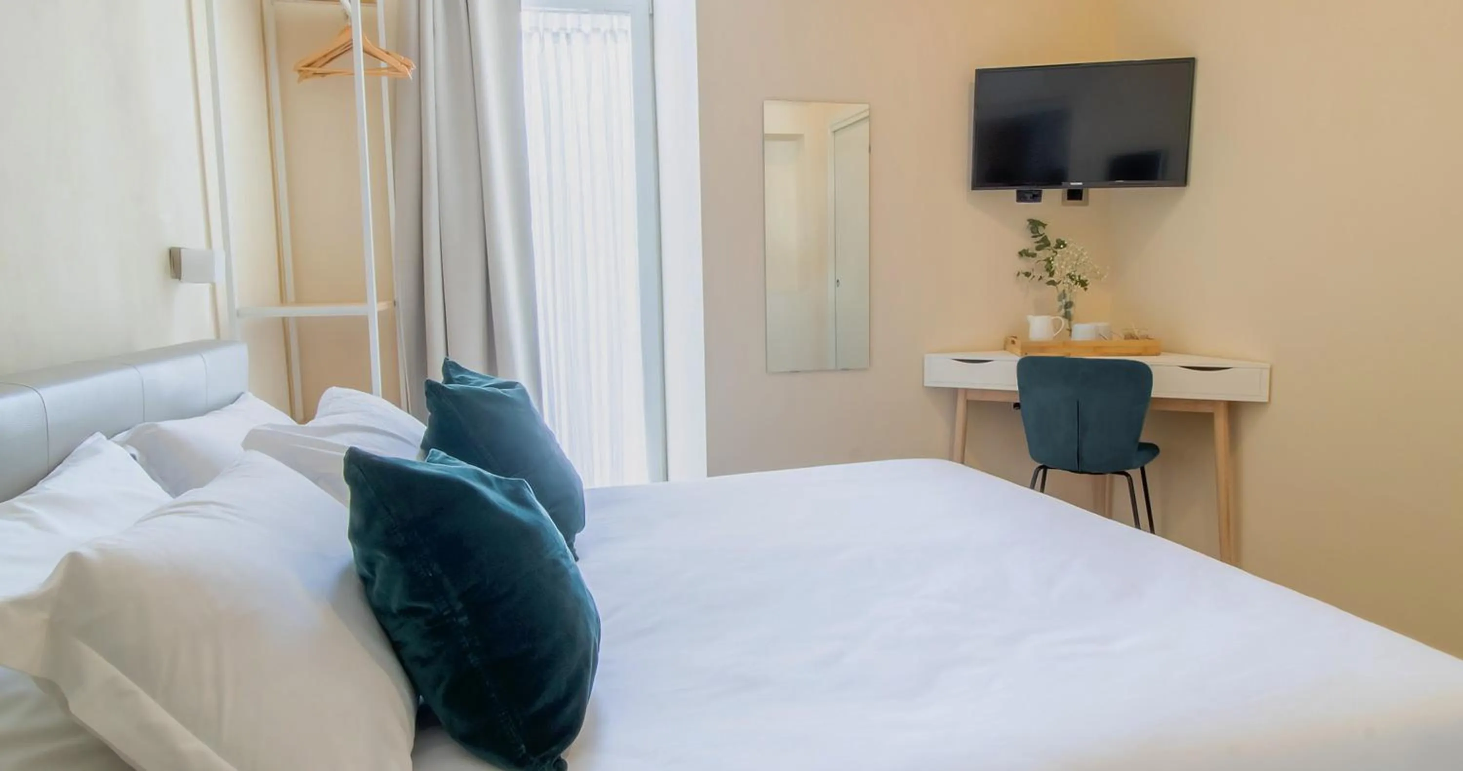 Bed in Musto Suites & Rooms