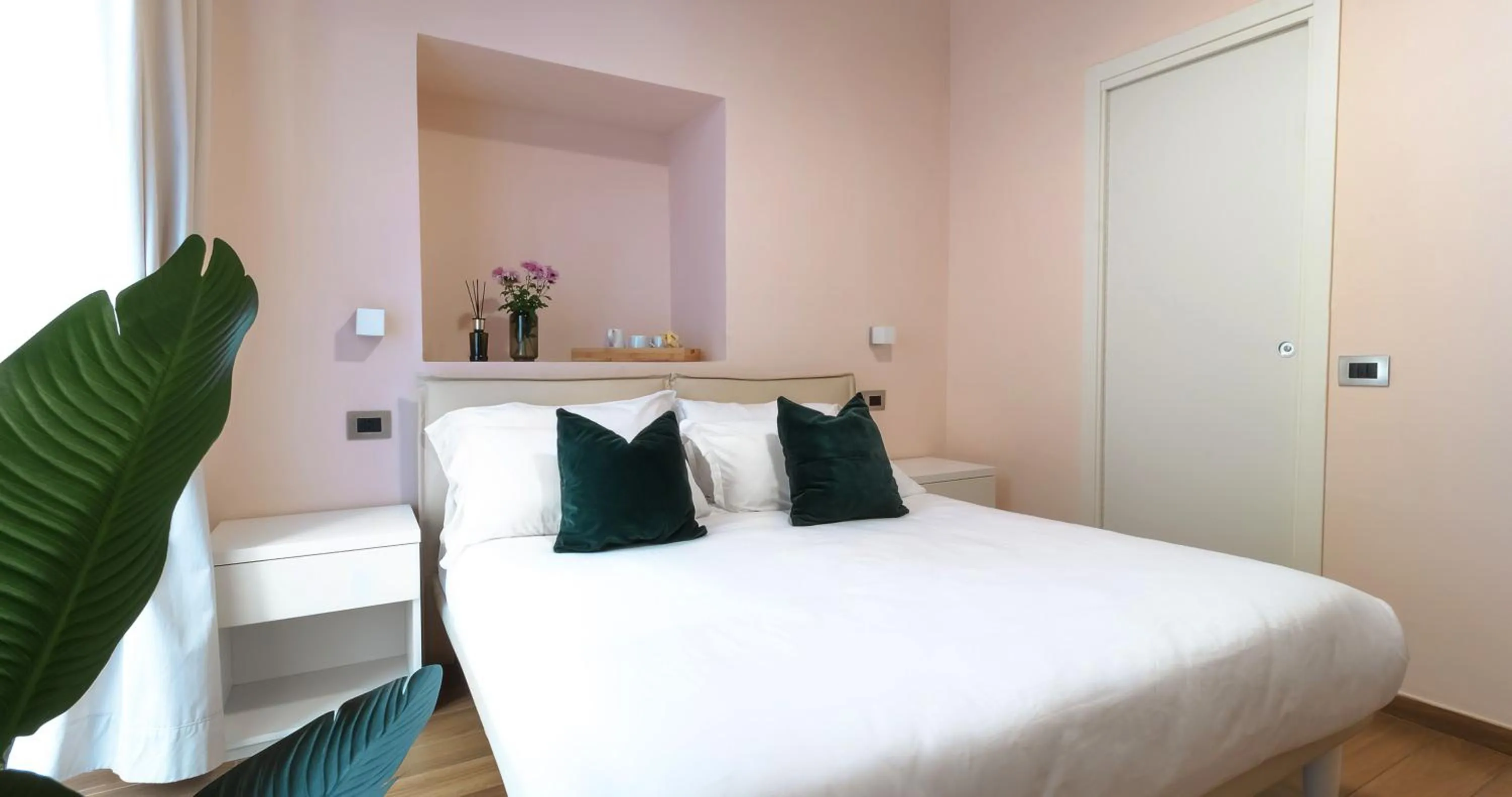 Bed in Musto Suites & Rooms