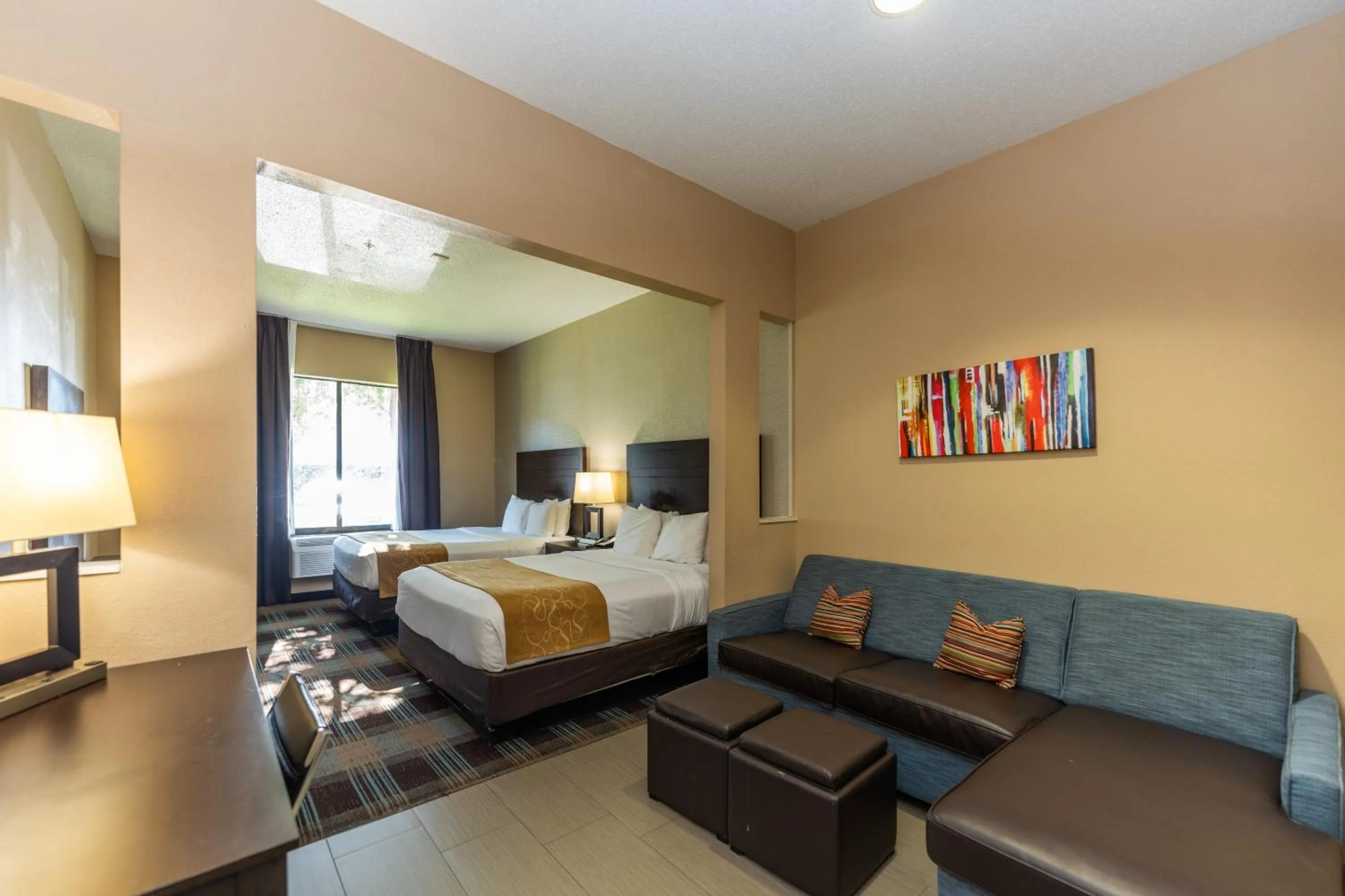 Living room, Bed in Comfort Suites Houston West at Clay Road