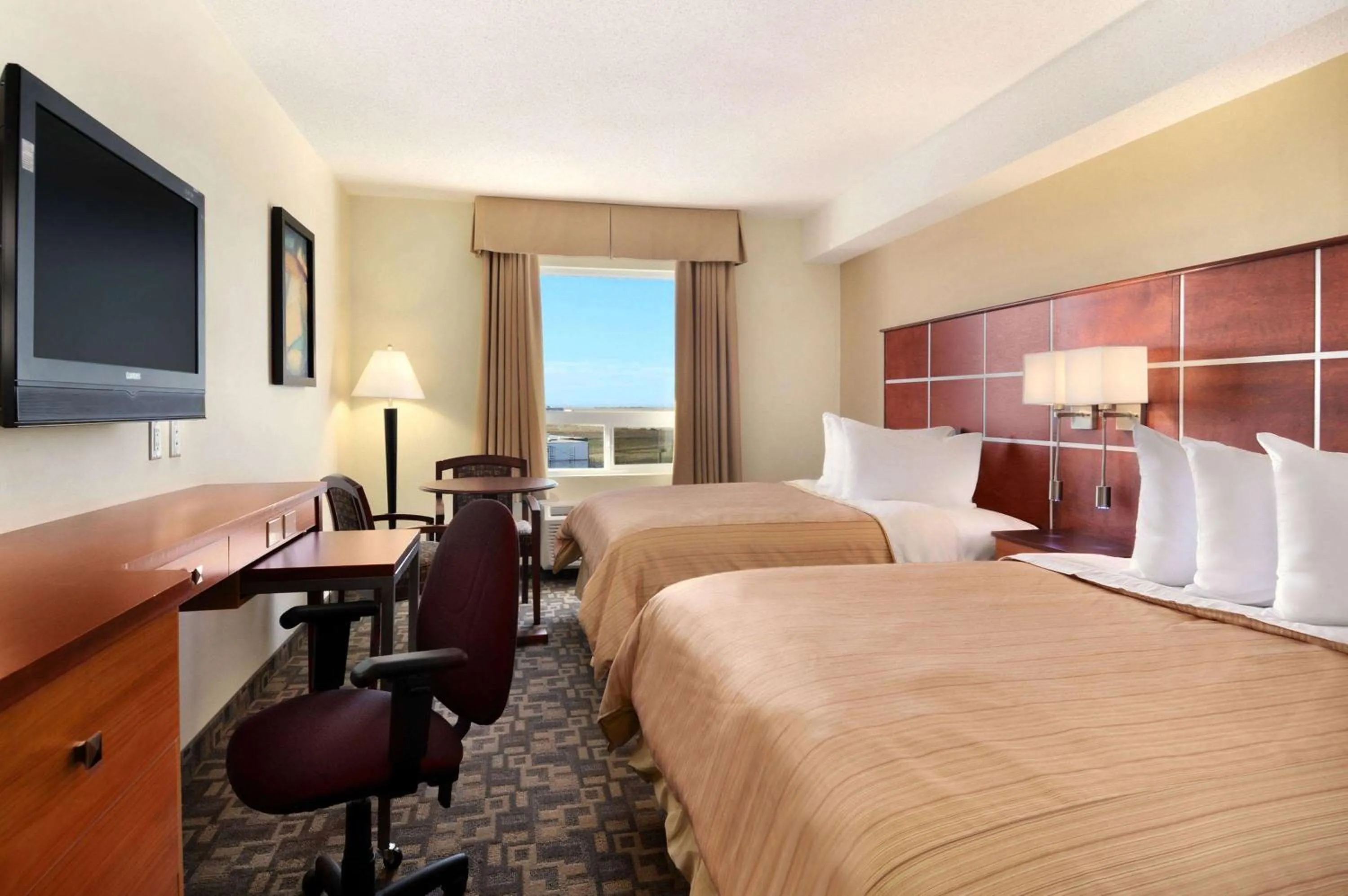 Photo of the whole room, Bed in Days Inn by Wyndham Grande Prairie