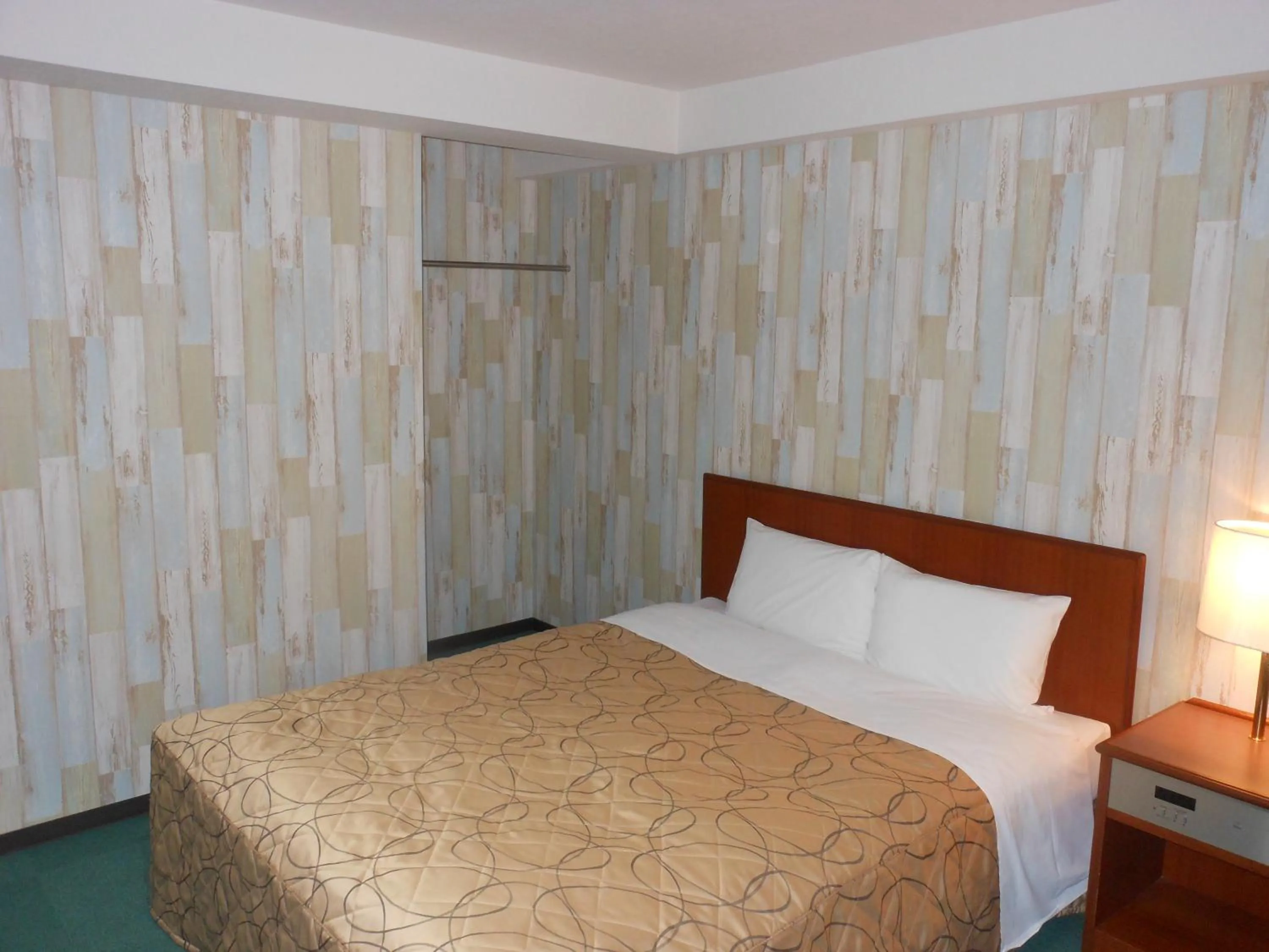 Bed in Hotel New Tohoku