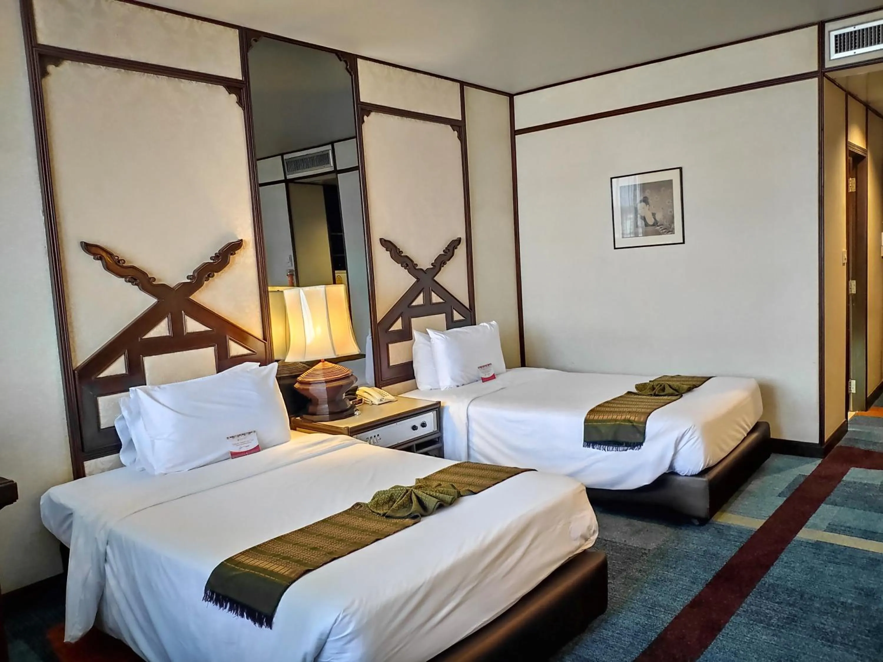 Bed in Chiang Mai Orchid Hotel