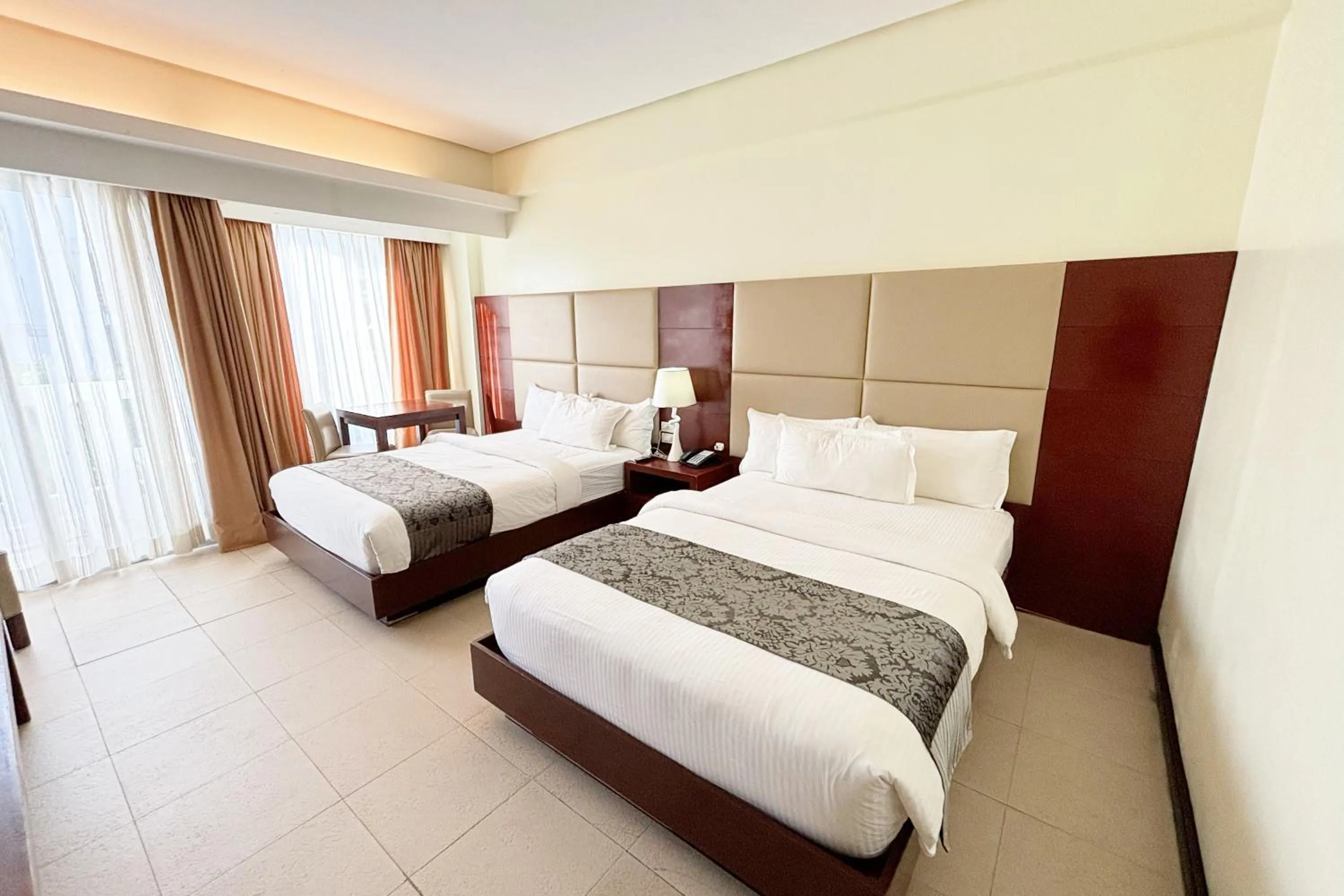 Bed in The Muse Beach Front Hotel Boracay