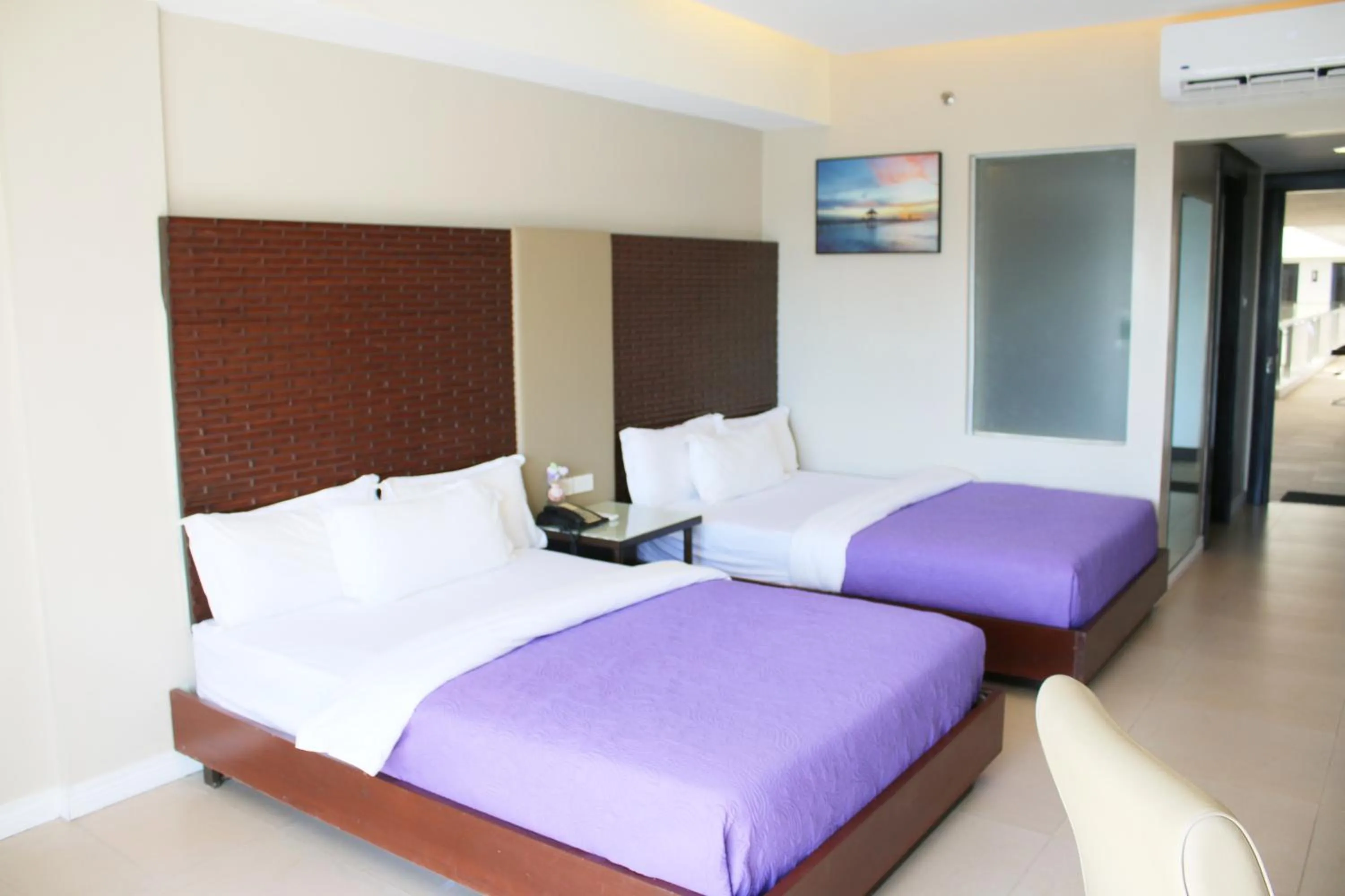 Bed in The Muse Beach Front Hotel Boracay