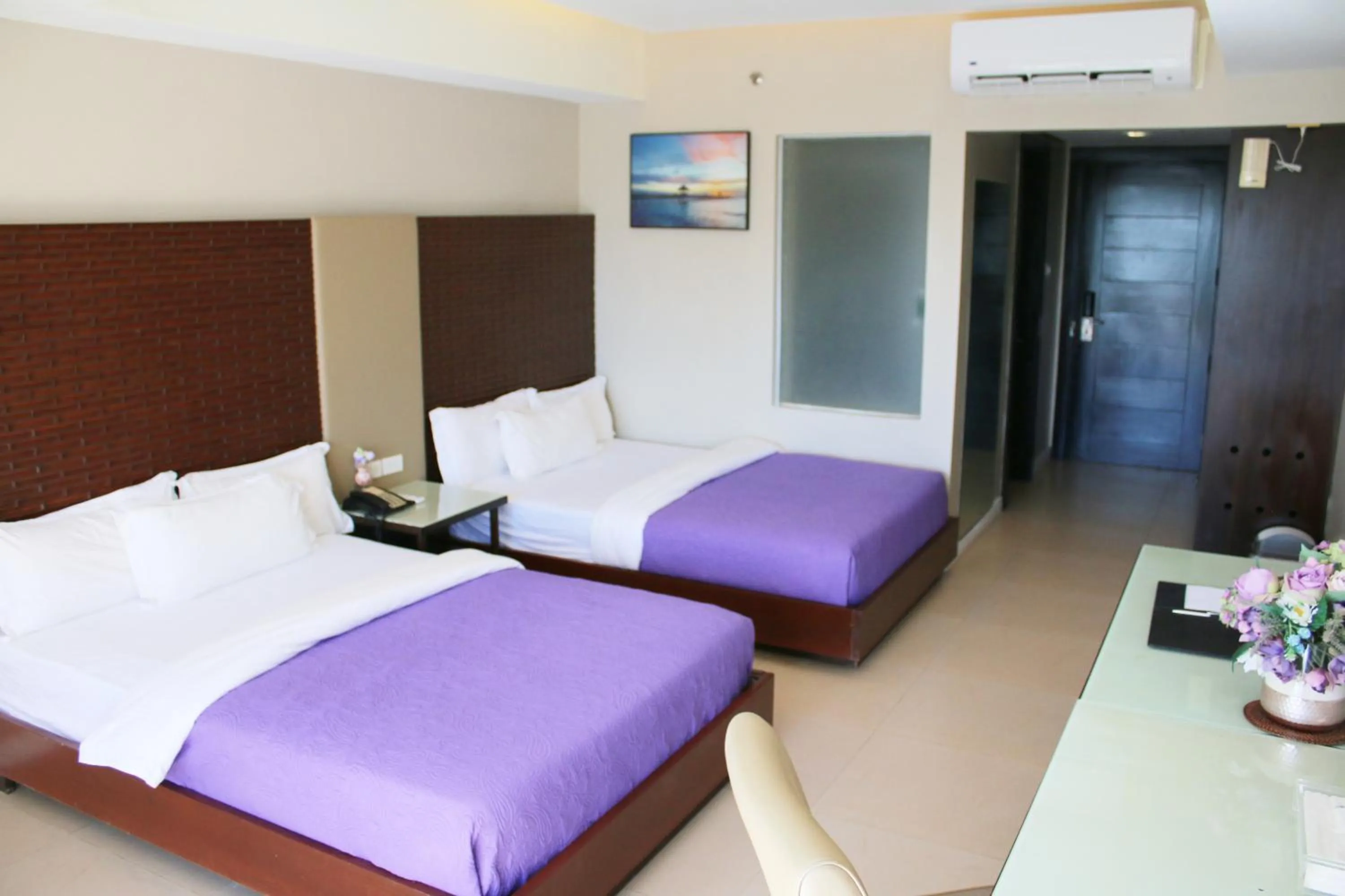 Bed in The Muse Beach Front Hotel Boracay