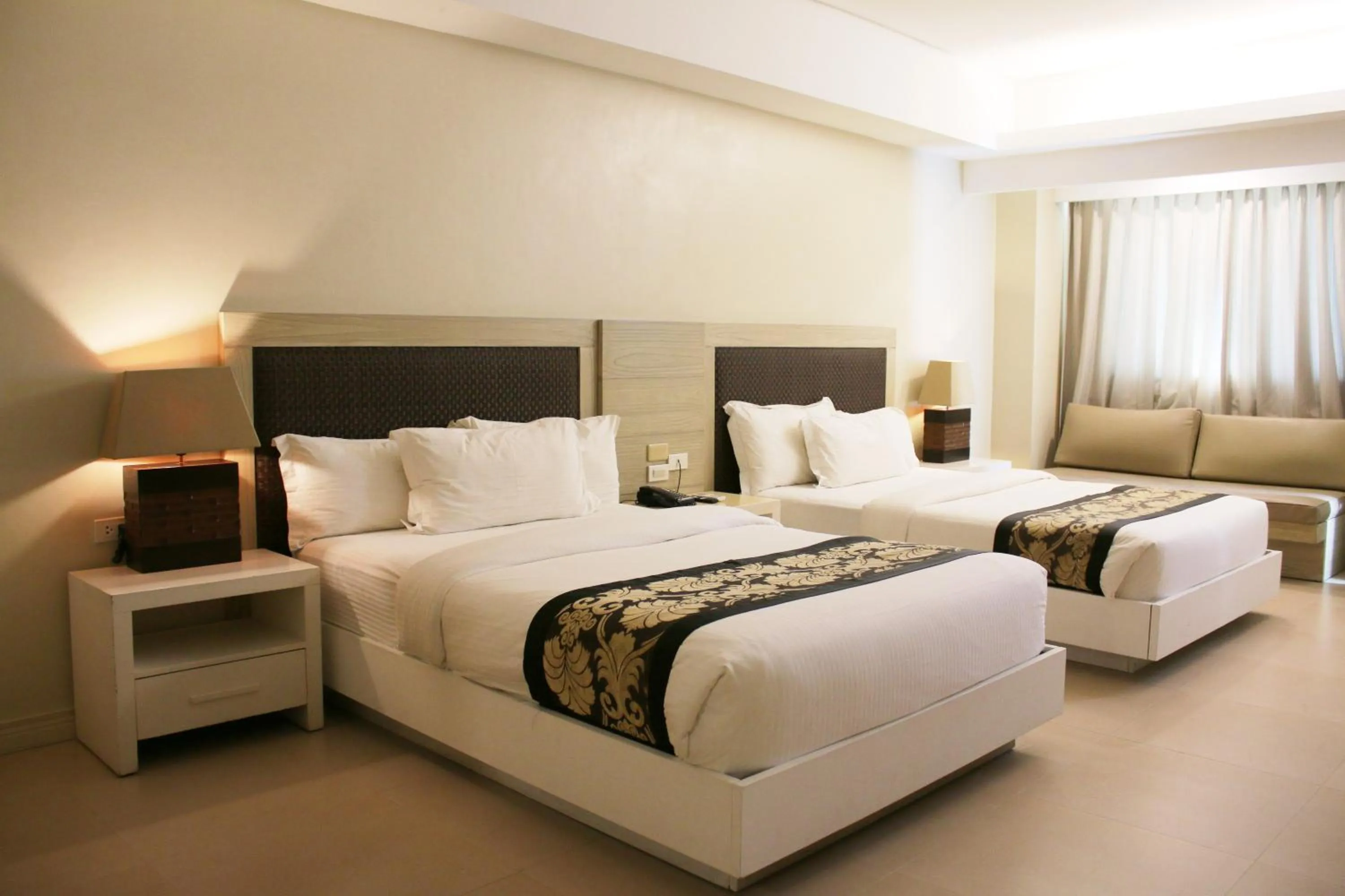 Bed in The Muse Beach Front Hotel Boracay