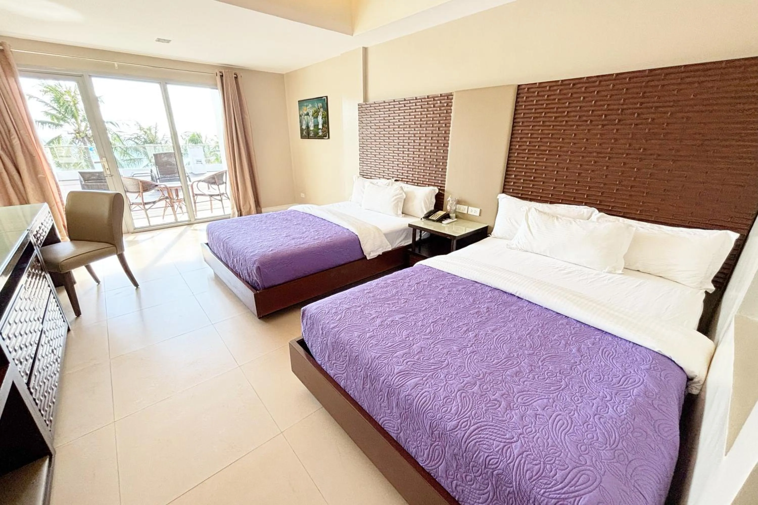Bed in The Muse Beach Front Hotel Boracay